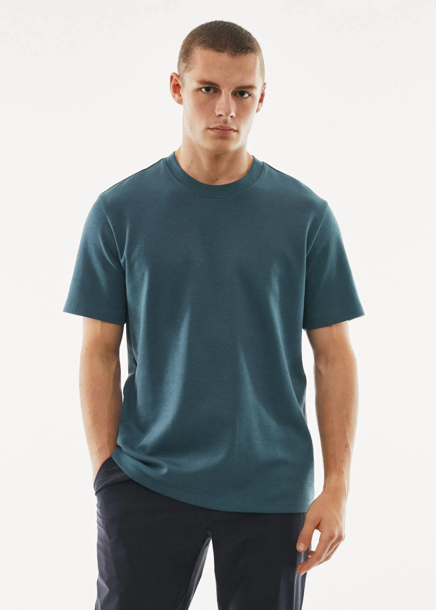 Mango Breathable cotton t-shirt. a young man wearing a blue t-shirt. 