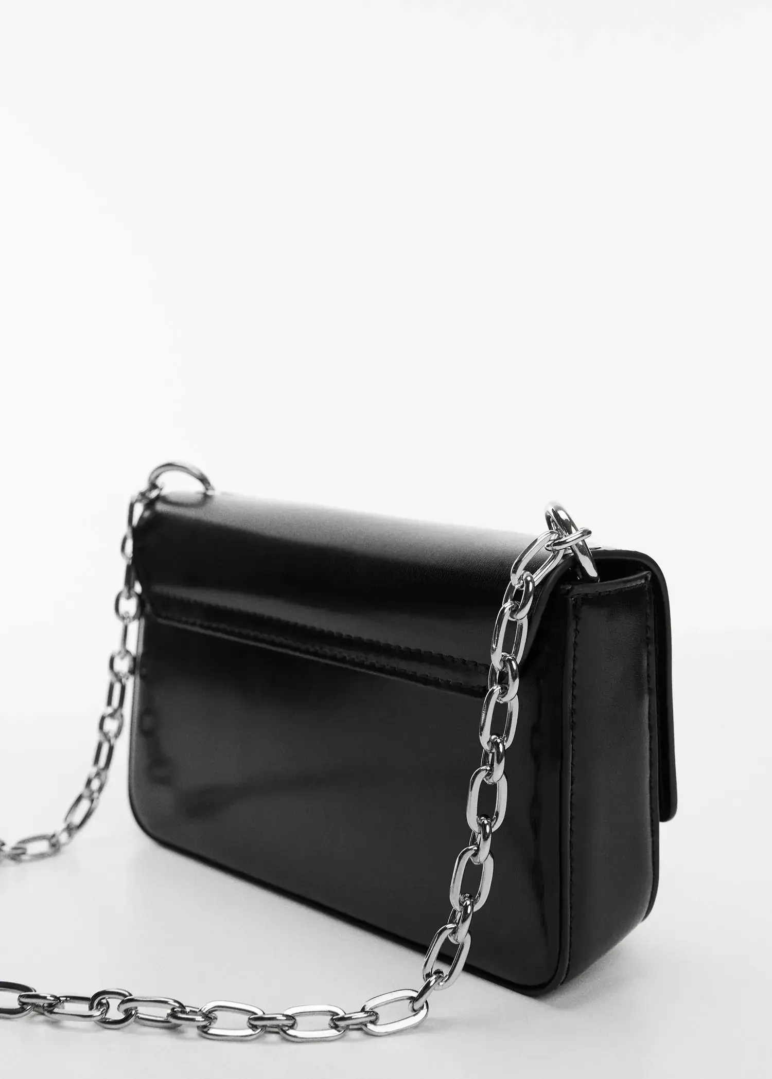 Mango Flap chain bag. a black purse with a silver chain on top of it. 