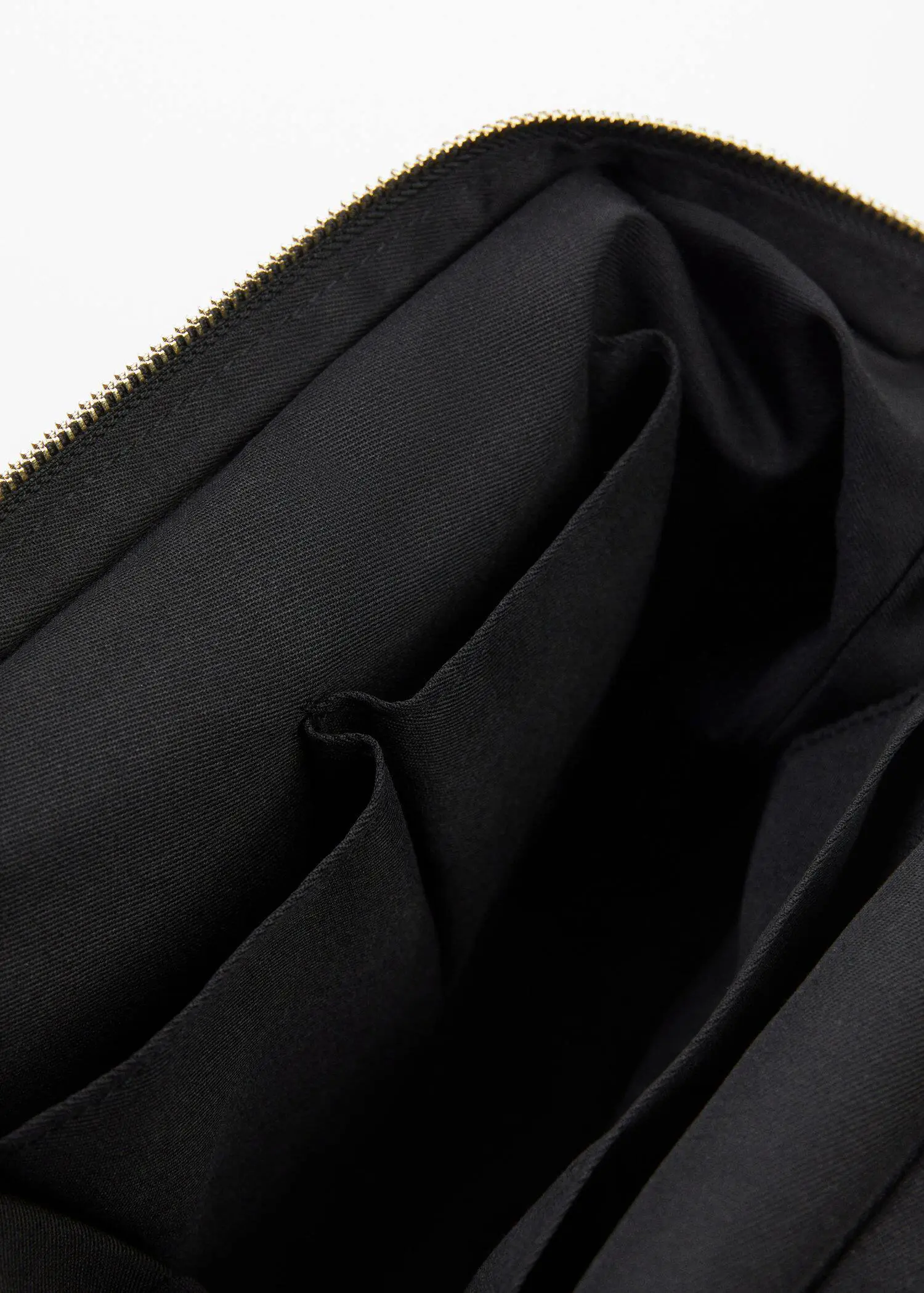 Mango Zipped nylon cosmetics bag. a close-up view of the inside of a black bag. 