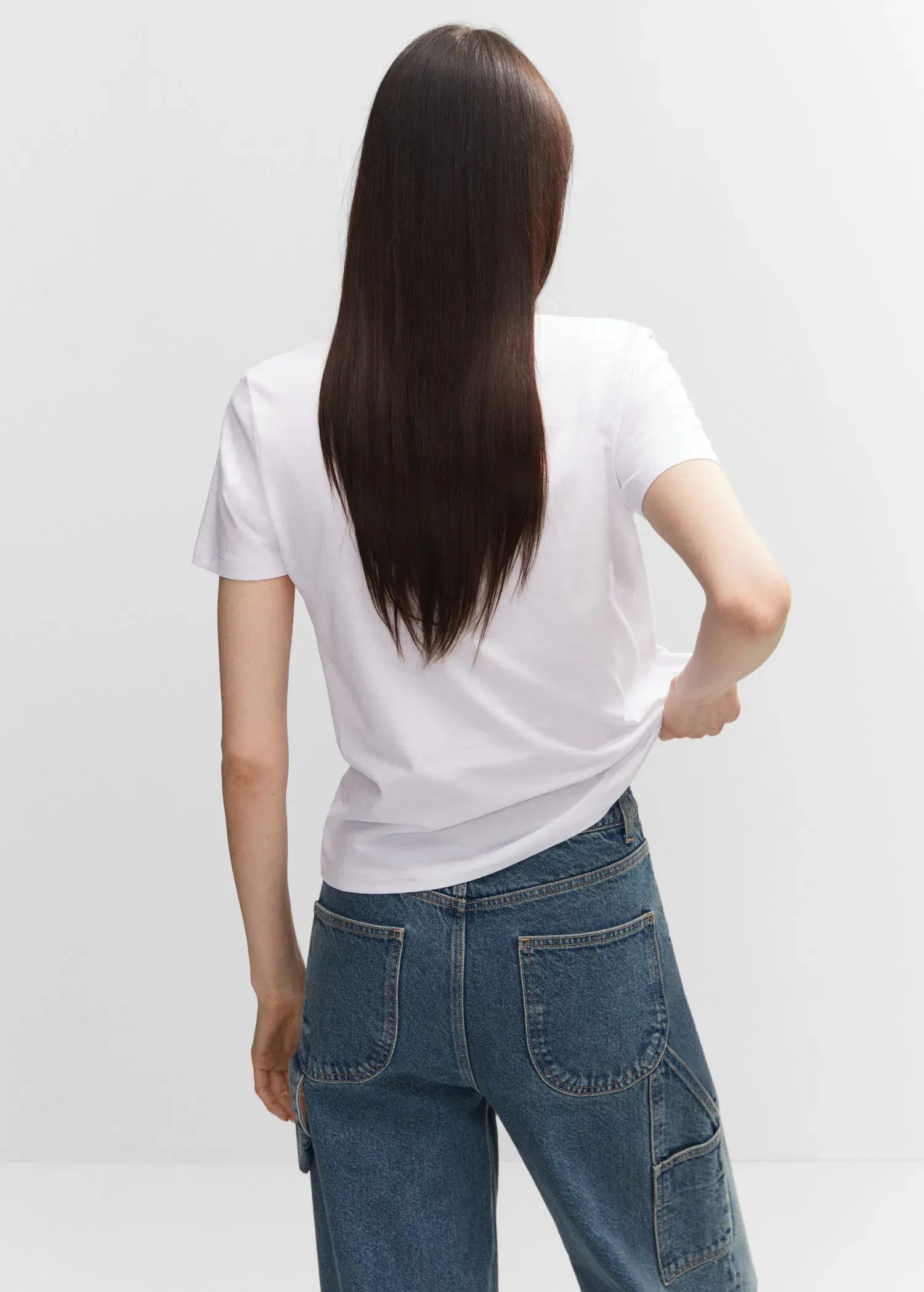 Mango 100% cotton T-shirt. a person with long hair wearing a white t-shirt. 