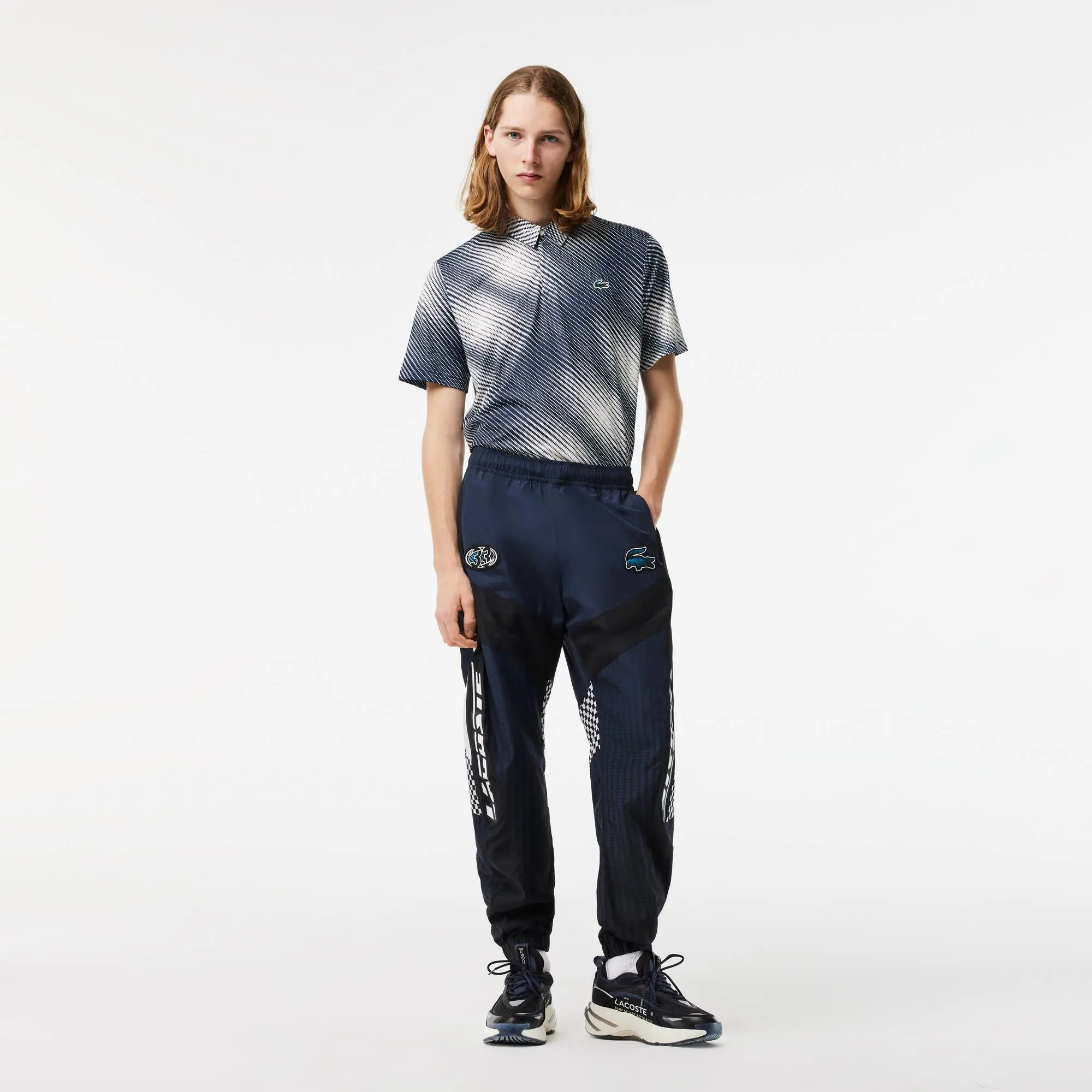 Lacoste Men’s Lacoste Ombré Checkerboard Print Track Pants. 1