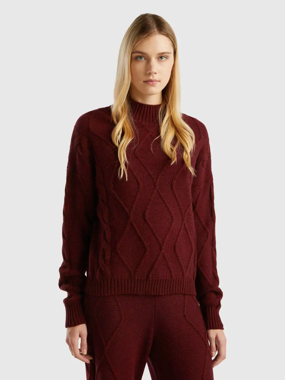 Benetton turtleneck with braids and diamond pattern. 1