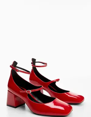 Patent leather buckled shoes