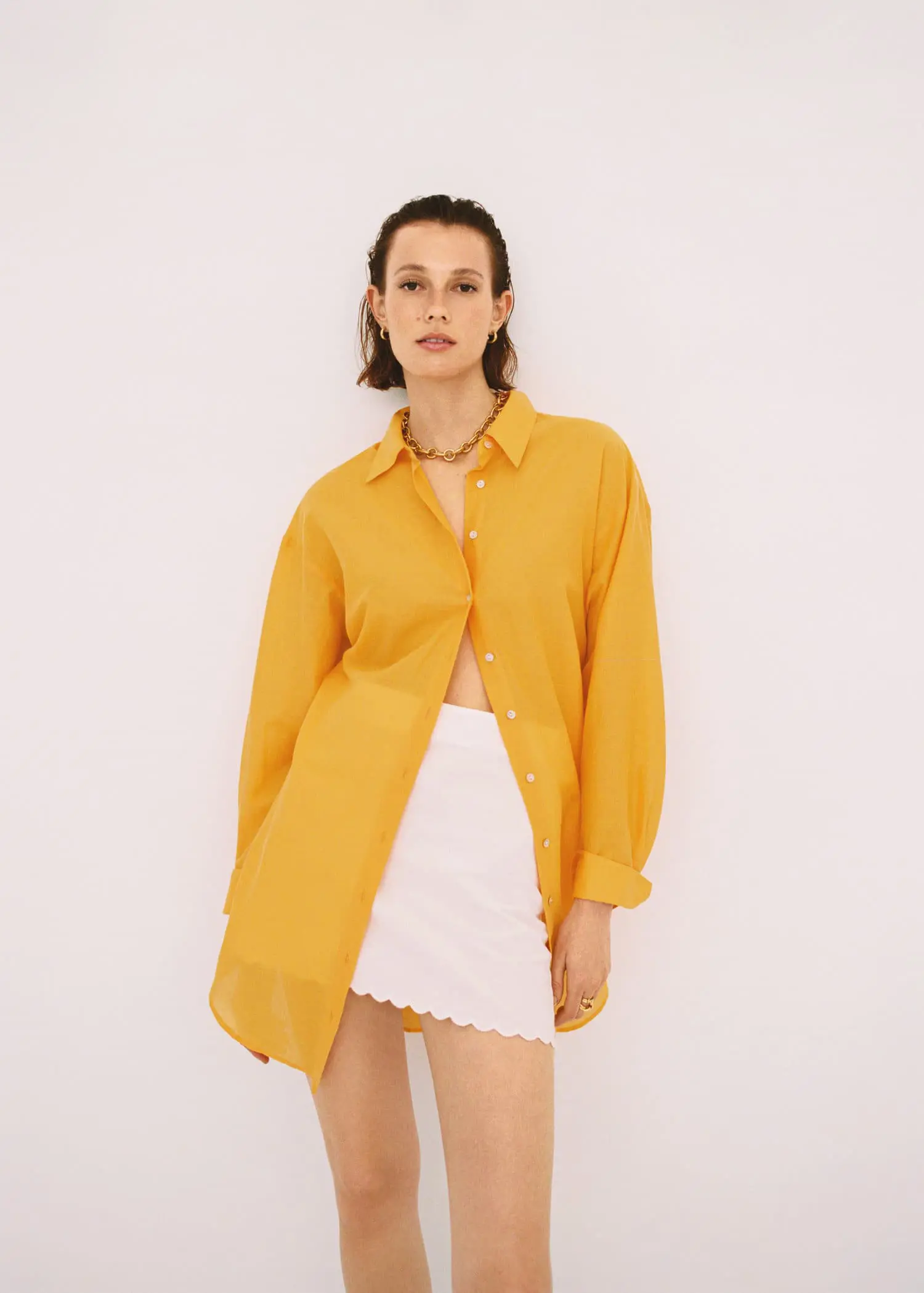 Mango Cotton linen-blend mini-skirt. a woman wearing a yellow shirt and a white skirt. 
