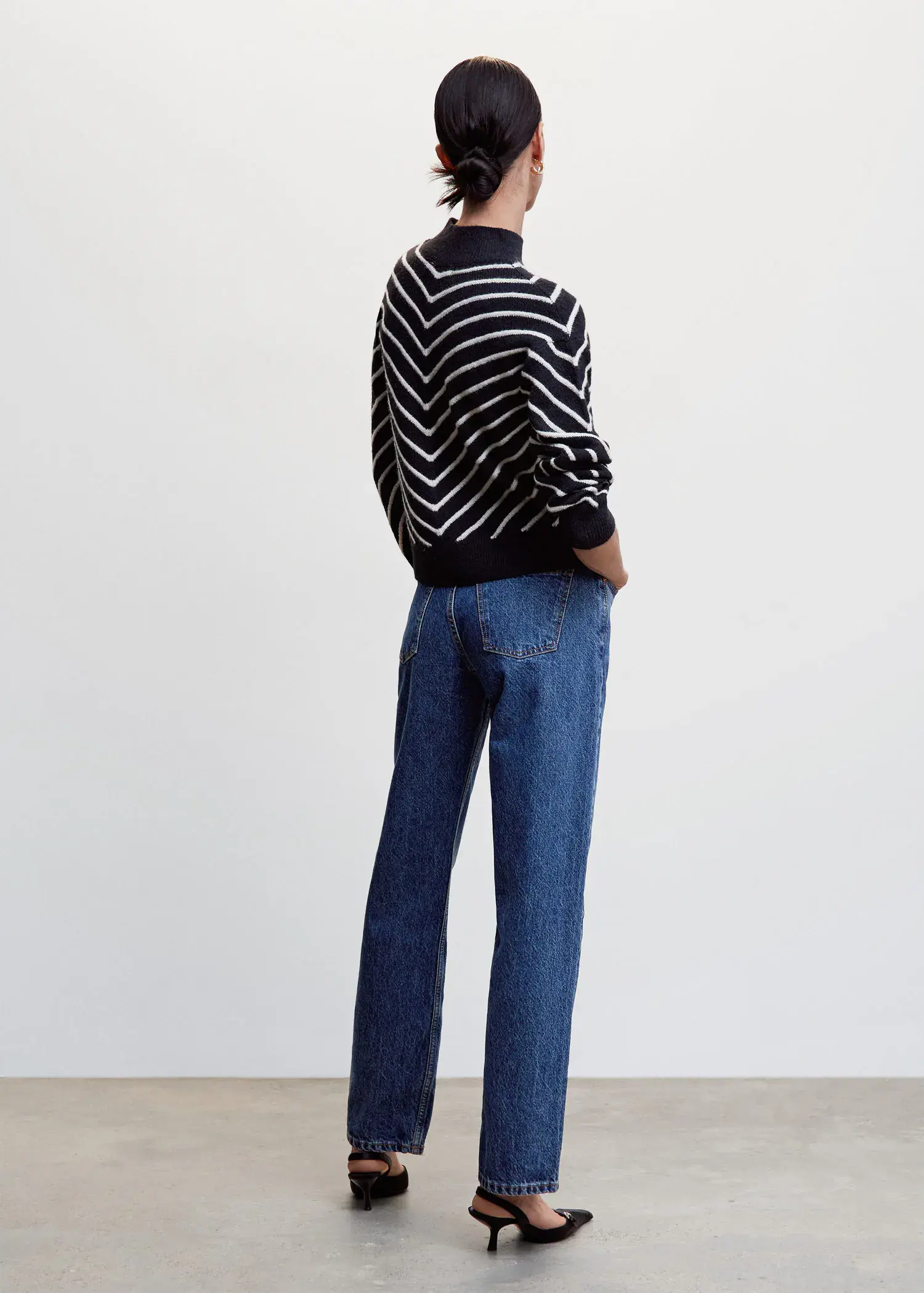 Mango Stripe-print sweater with Perkins neck. a person standing in front of a white wall. 