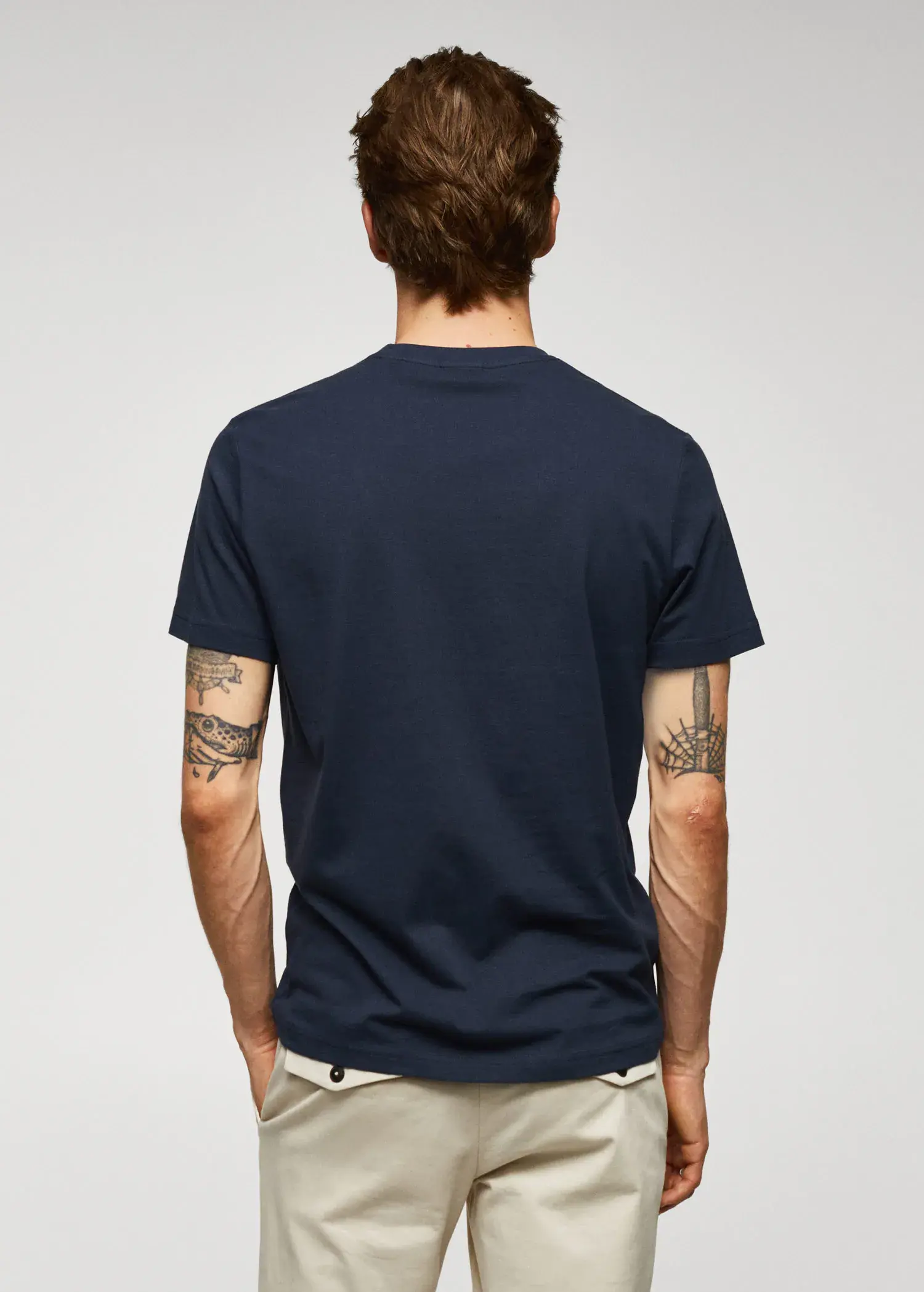 Mango 100% cotton t-shirt with logo. a man wearing a t-shirt with tattoos on his arms. 