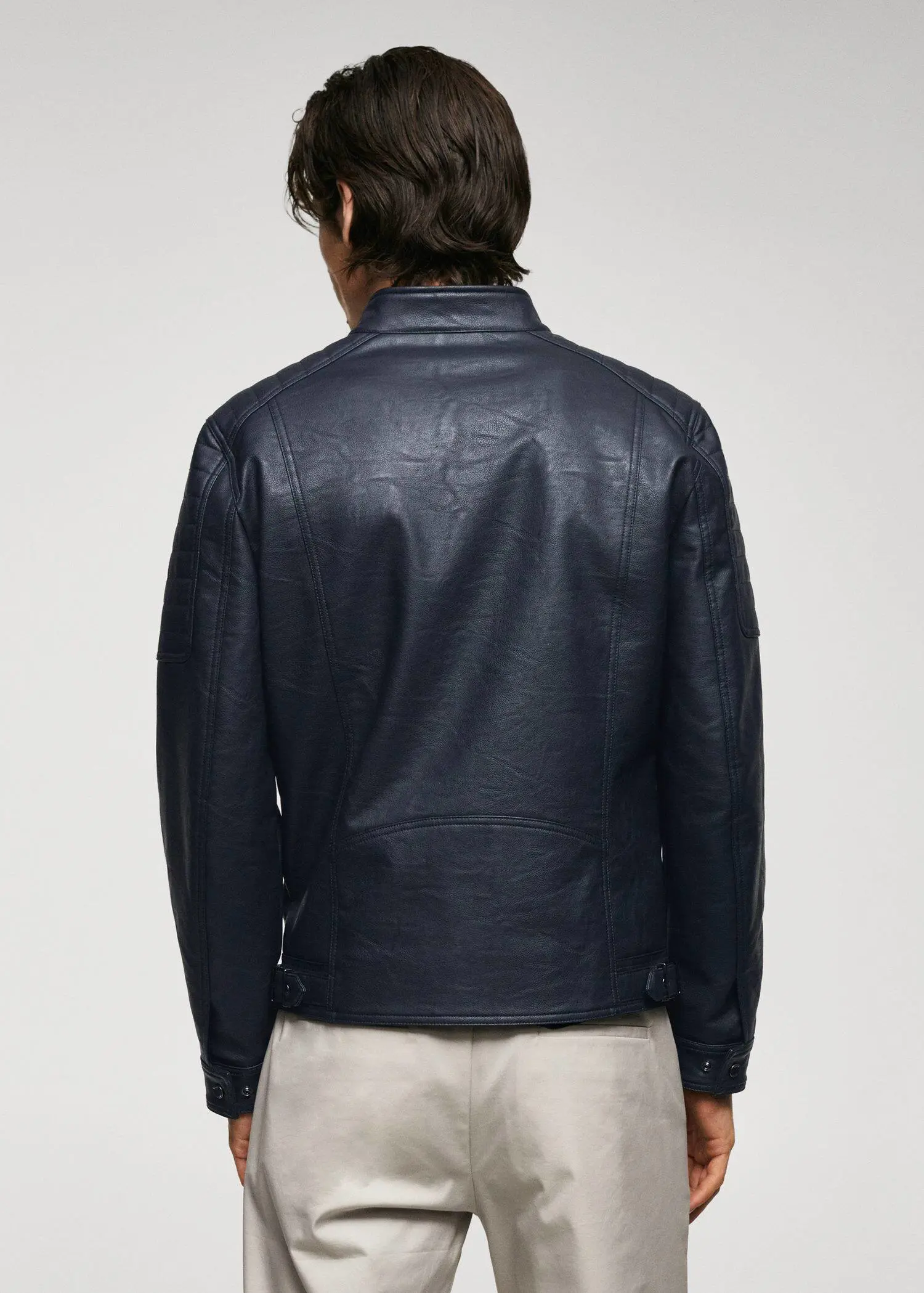 Mango Nappa leather-effect jacket. a man wearing a black leather jacket standing up. 