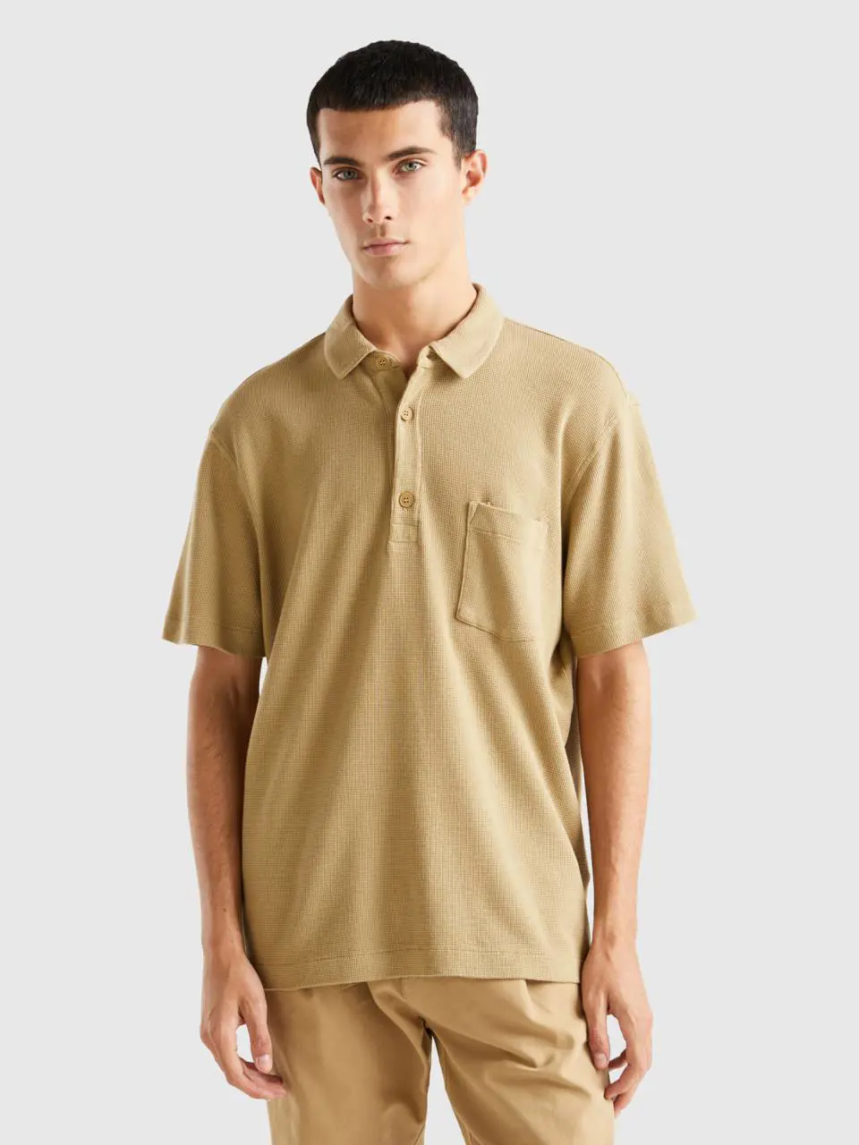 Benetton polo with pocket and relaxed fit. 1