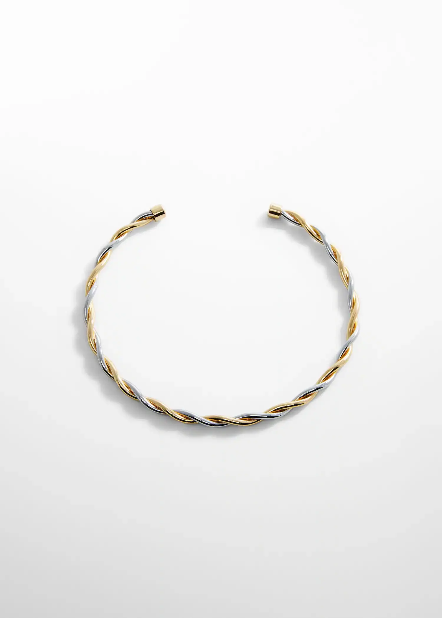 Mango Criss-cross rigid necklace. a close-up of a gold and silver bracelet on a white surface. 