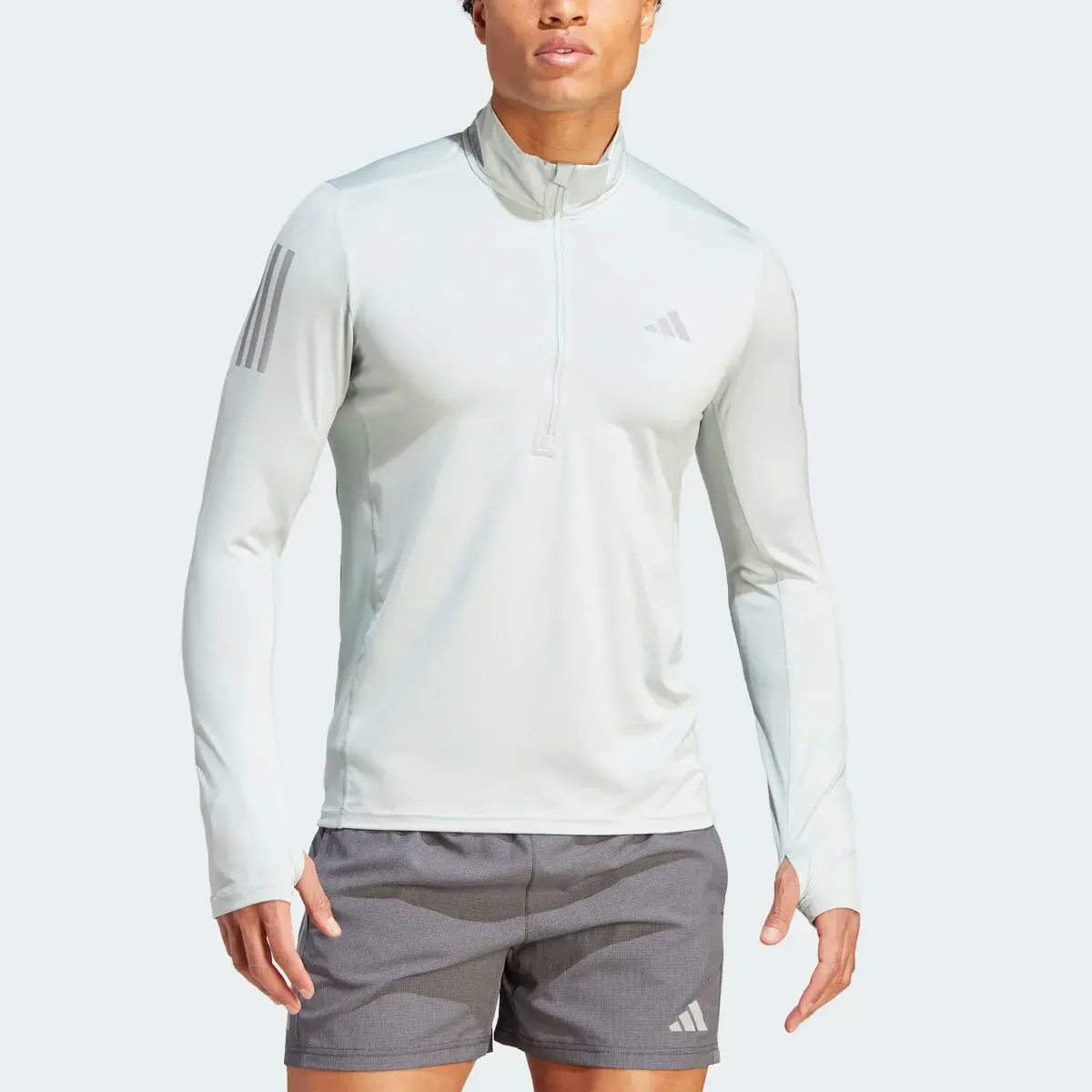 Adidas Own the Run 1/4 Zip Long Sleeve Sweatshirt. 1