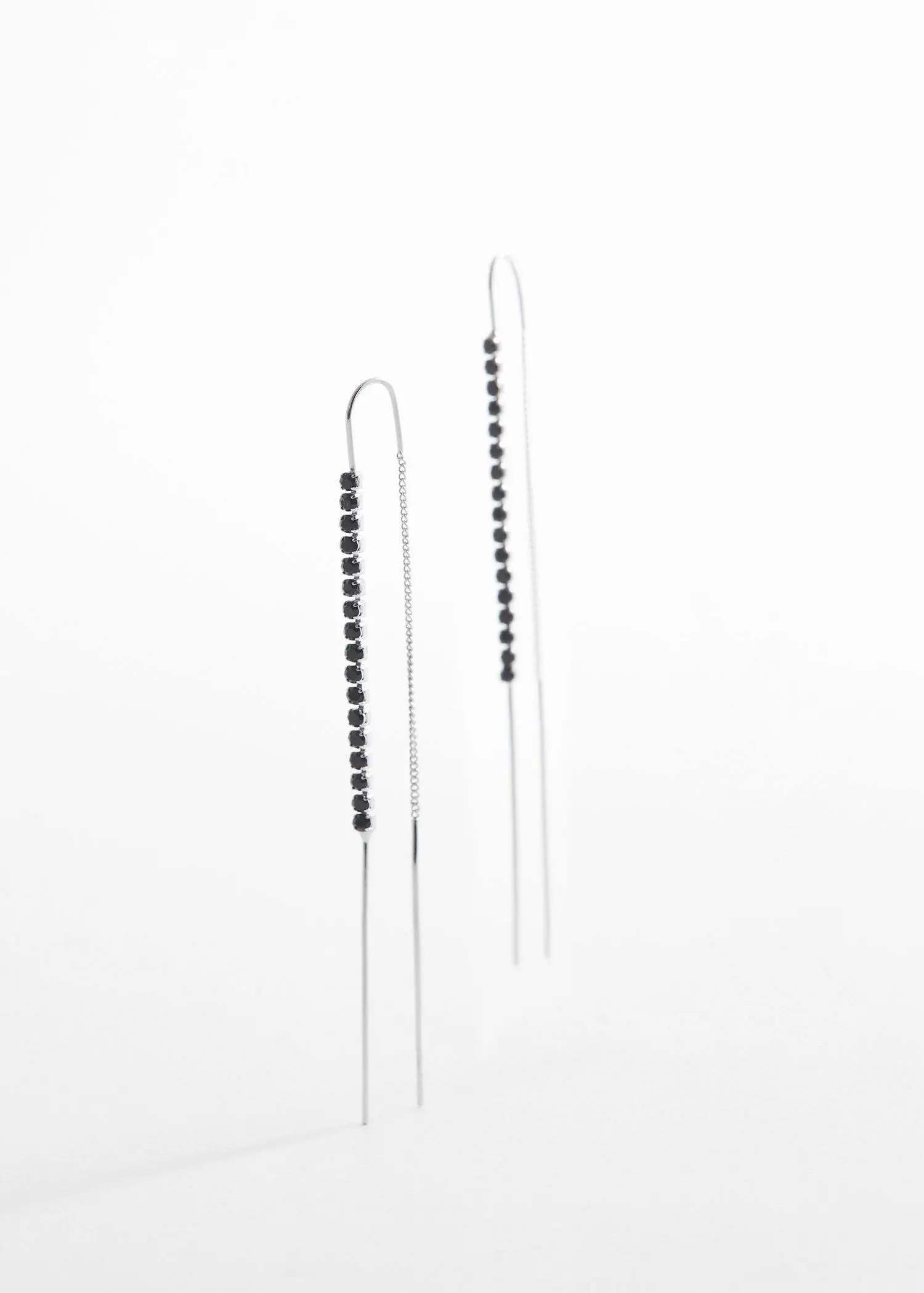 Mango Rhinestone thread earrings. a pair of long silver earrings with black beads. 