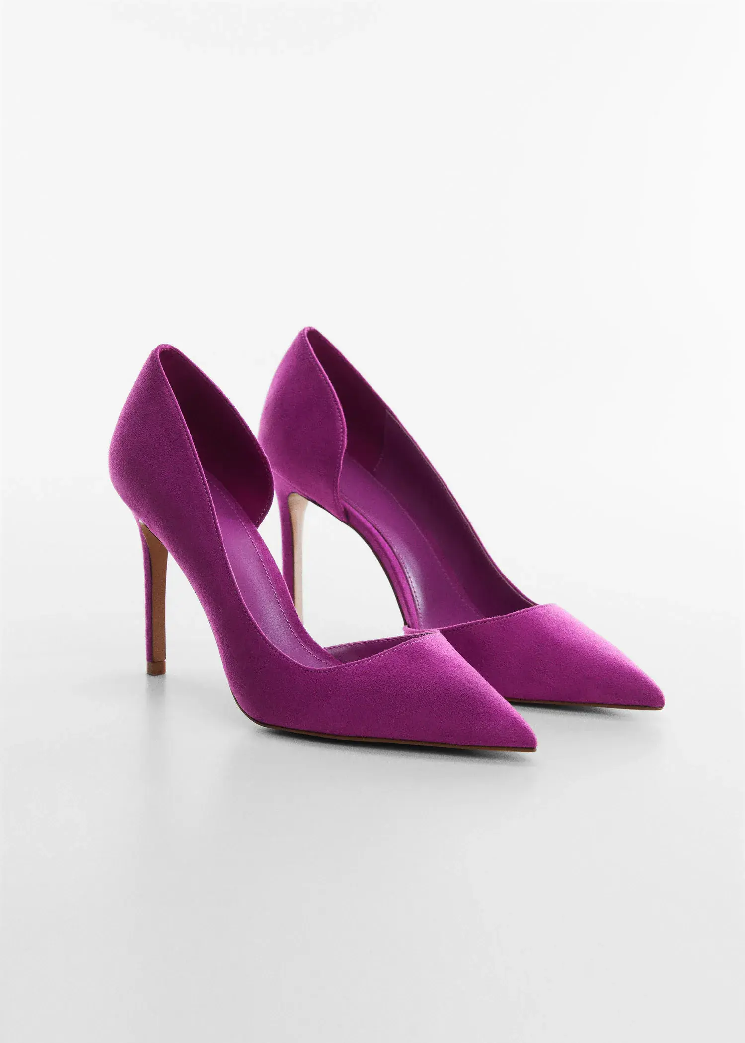 Mango Asymmetrical heeled shoes. a pair of purple high heels sitting on top of a table. 