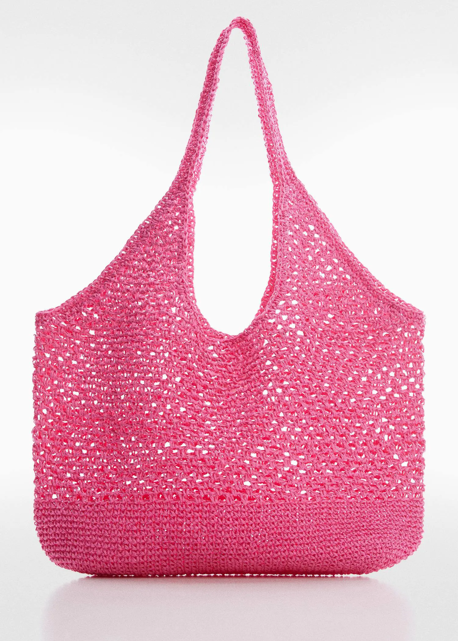 Mango Natural fibre sack bag. a close-up of a crocheted pink bag. 