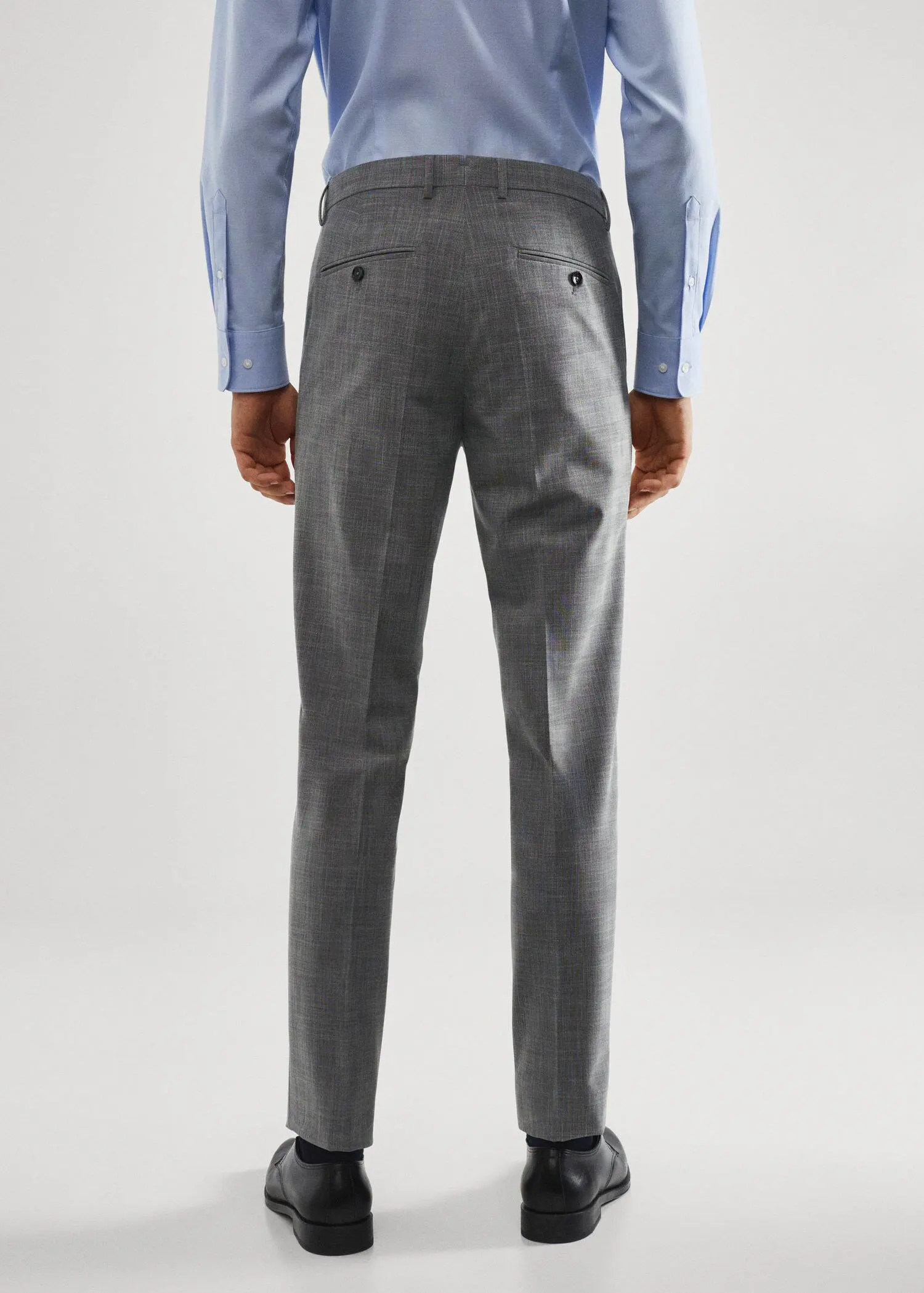 Mango Stretch fabric slim-fit printed suit pants. a man wearing a suit standing in front of a white wall. 