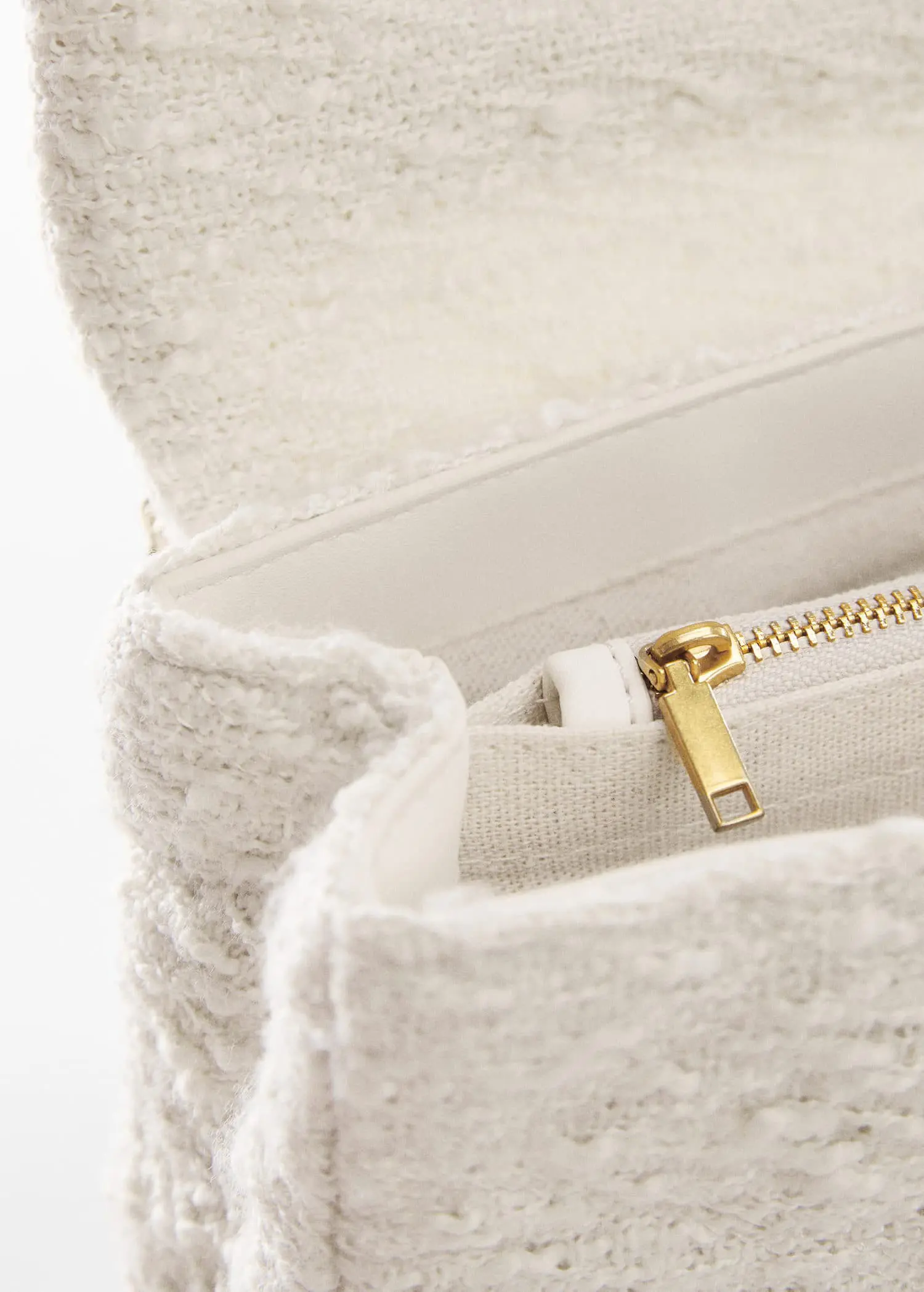 Mango Textured chain bag. a close-up view of the inside of a purse. 