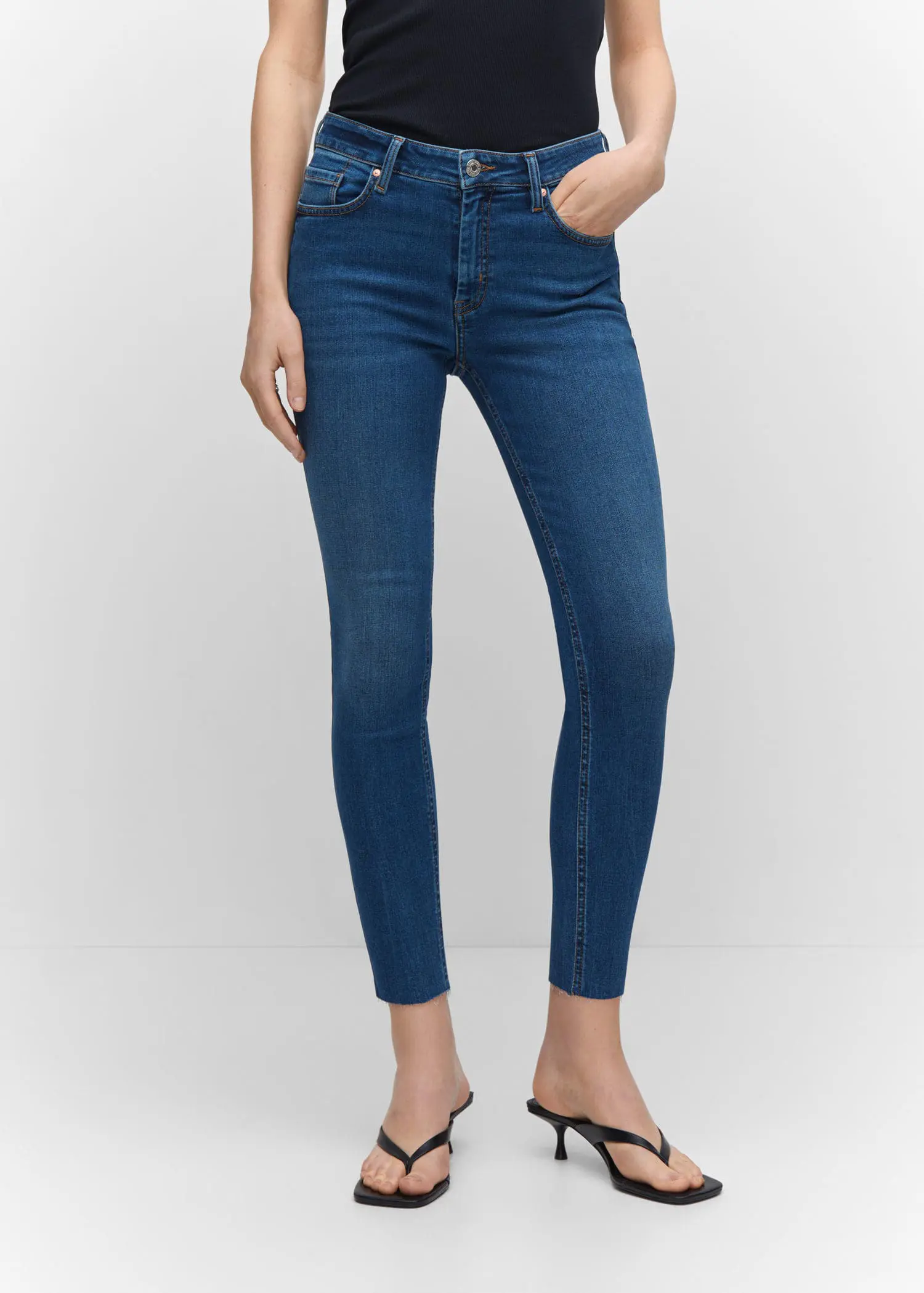 Mango Skinny cropped jeans. a woman is wearing a pair of jeans. 