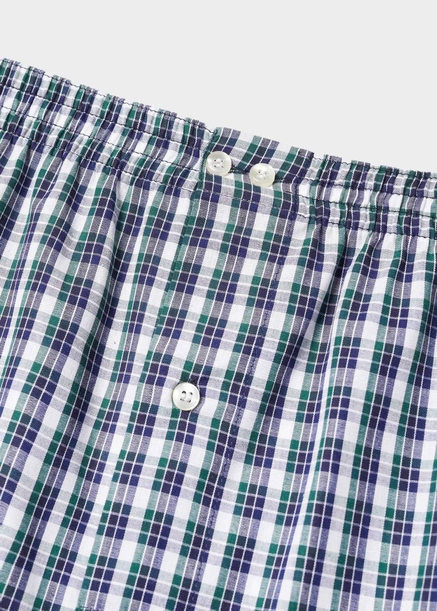 Mango Vichy check cotton briefs. a close-up view of the buttons on a pair of boxers. 