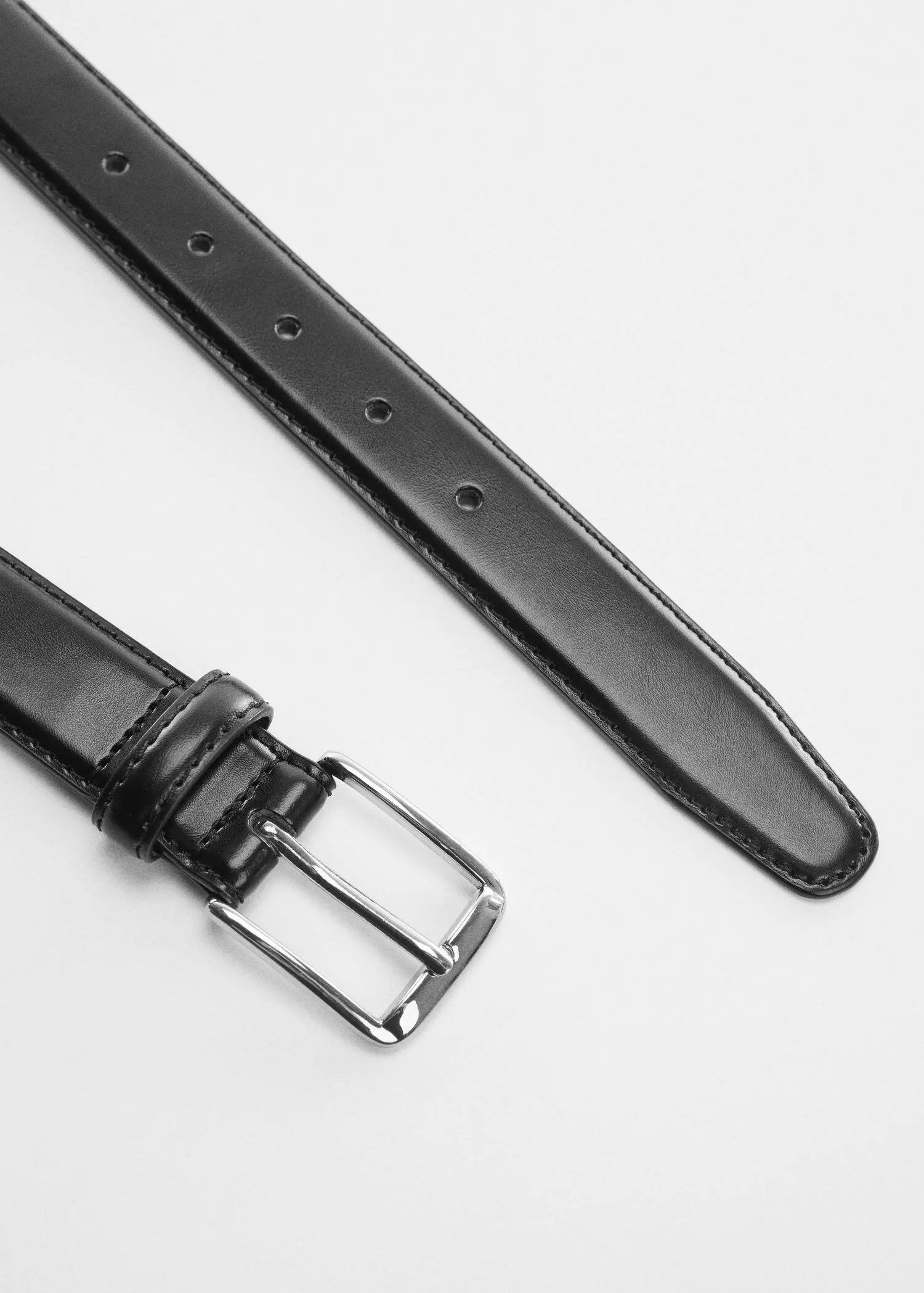 Mango Leather belt. a close-up of a black leather belt with a silver buckle. 