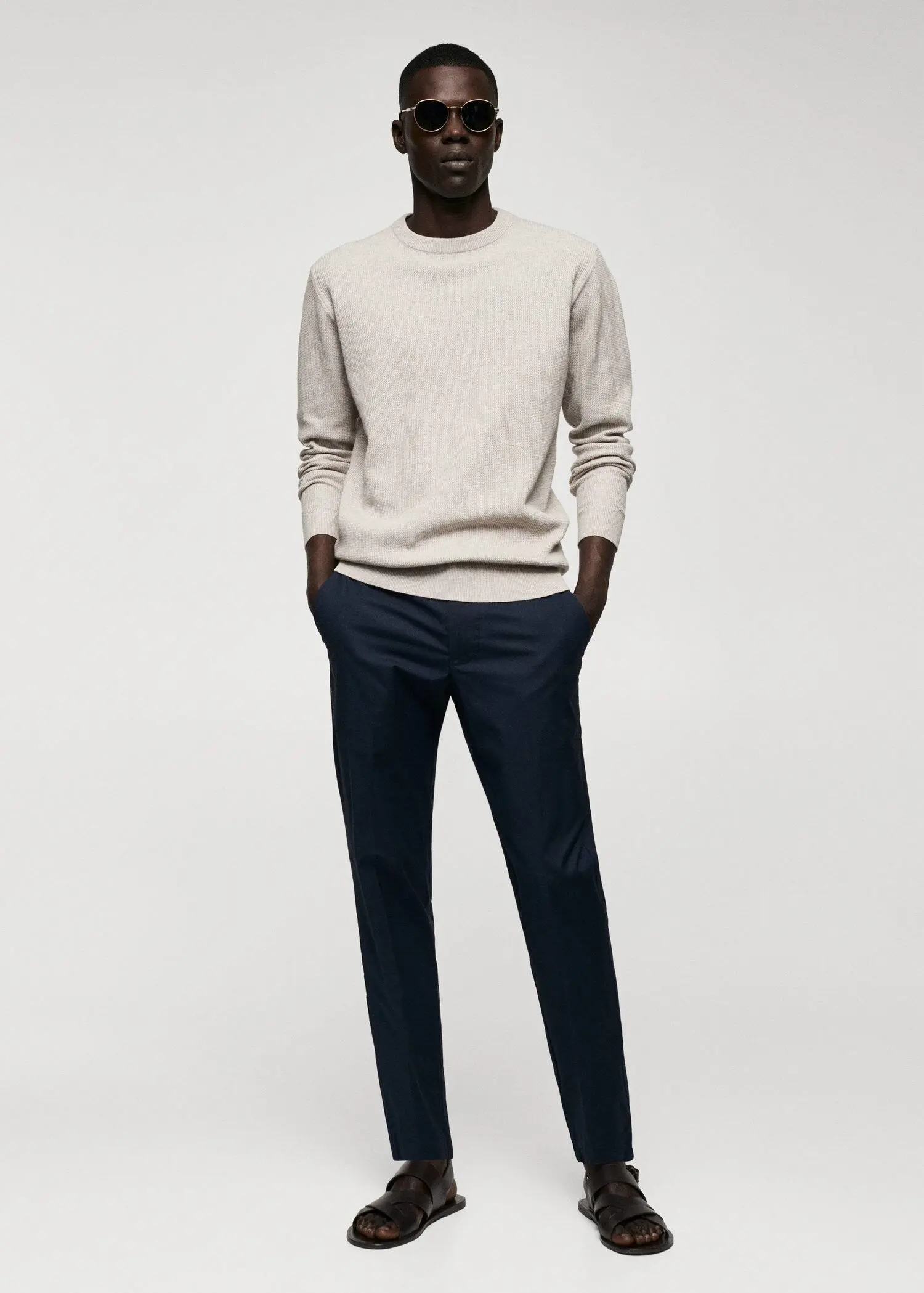 Mango Structured cotton sweater. a man in a white shirt and black pants. 