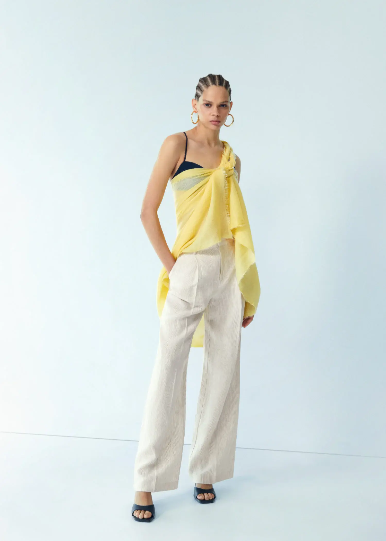 Mango Straight linen-blend pants. a woman wearing a yellow top and white pants. 