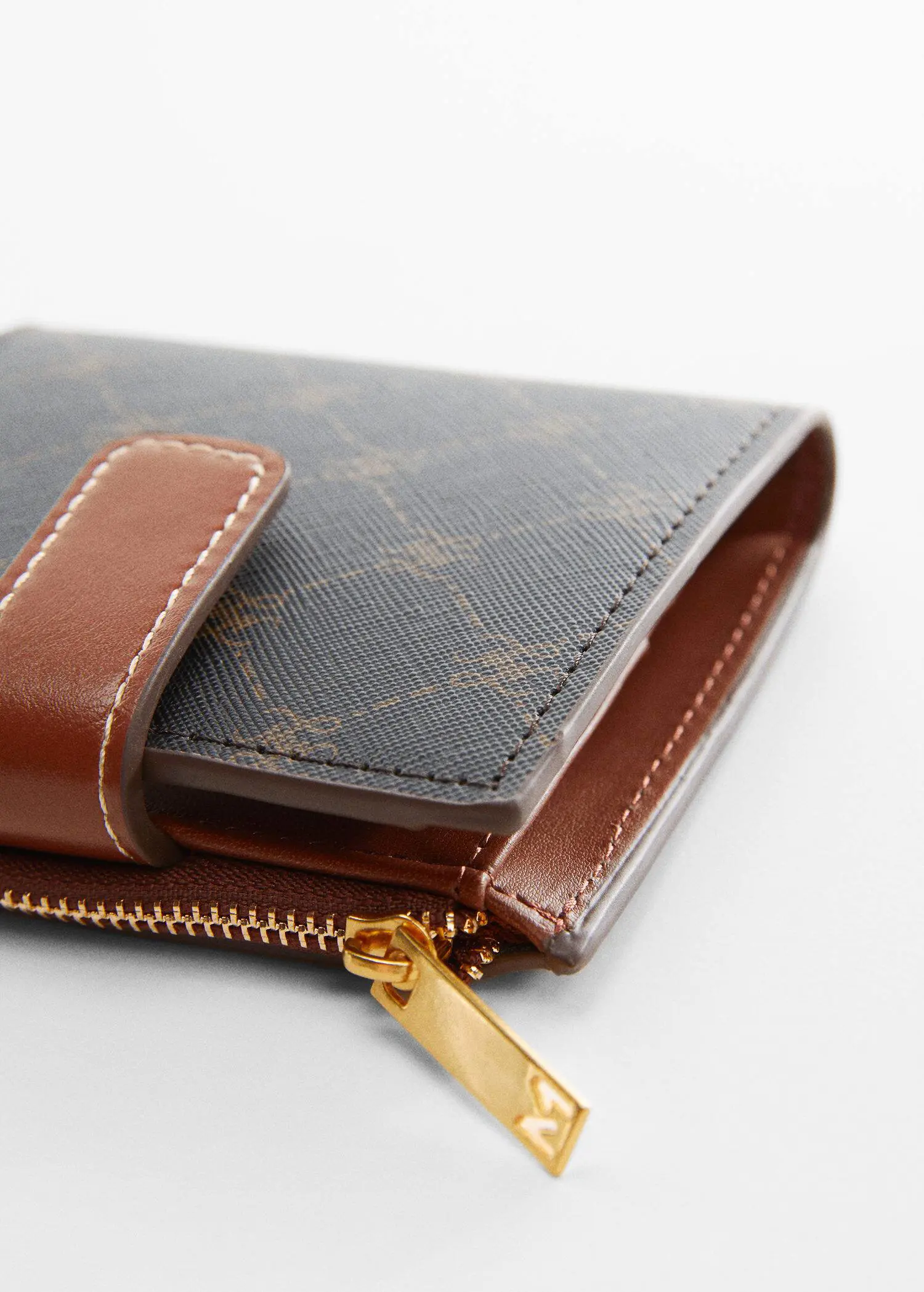 Mango Wallet with printed logo. a close-up of a brown wallet with a zipper. 