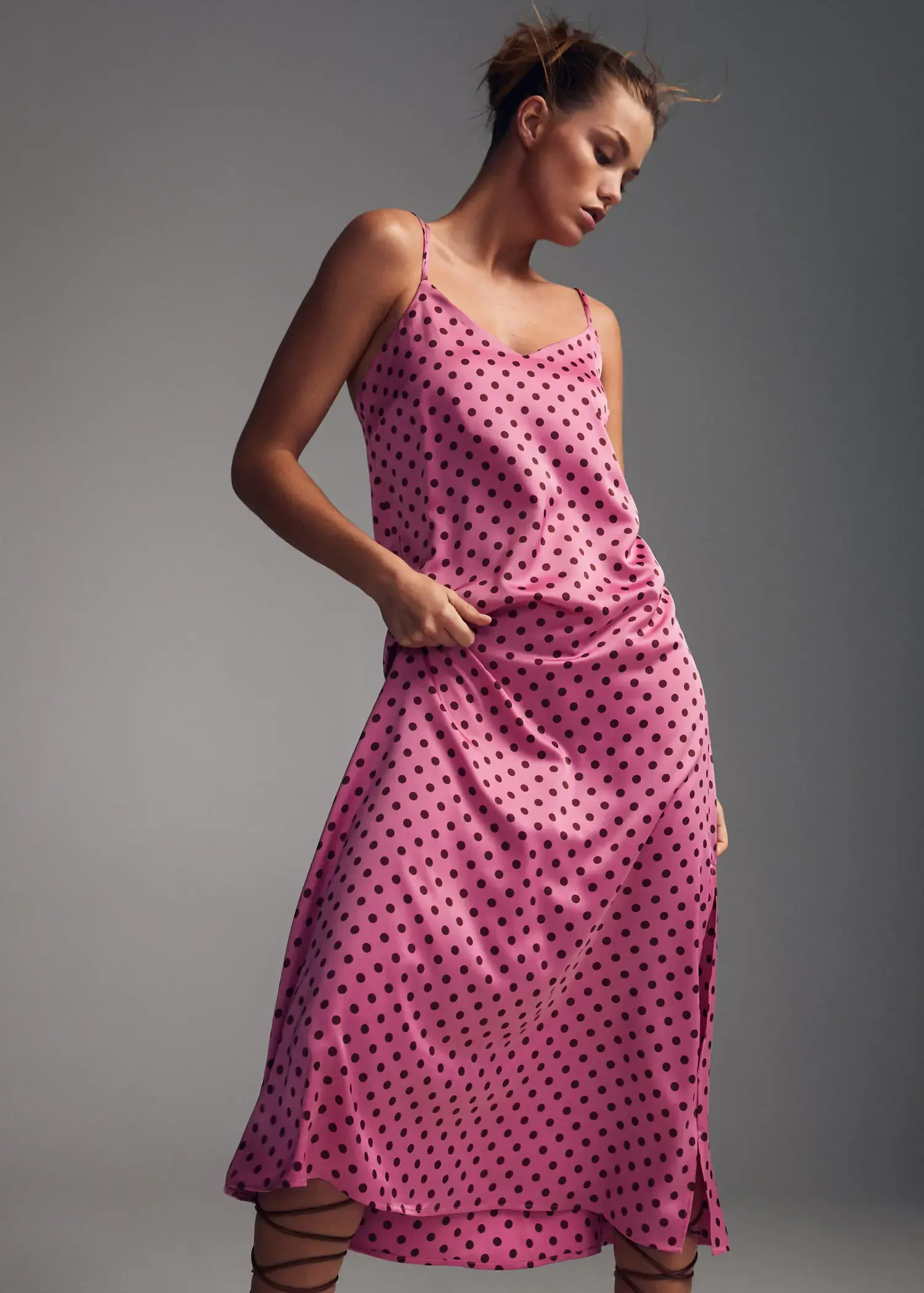 Mango Polka-dot satin-finish dress. a woman wearing a pink polka dot dress. 