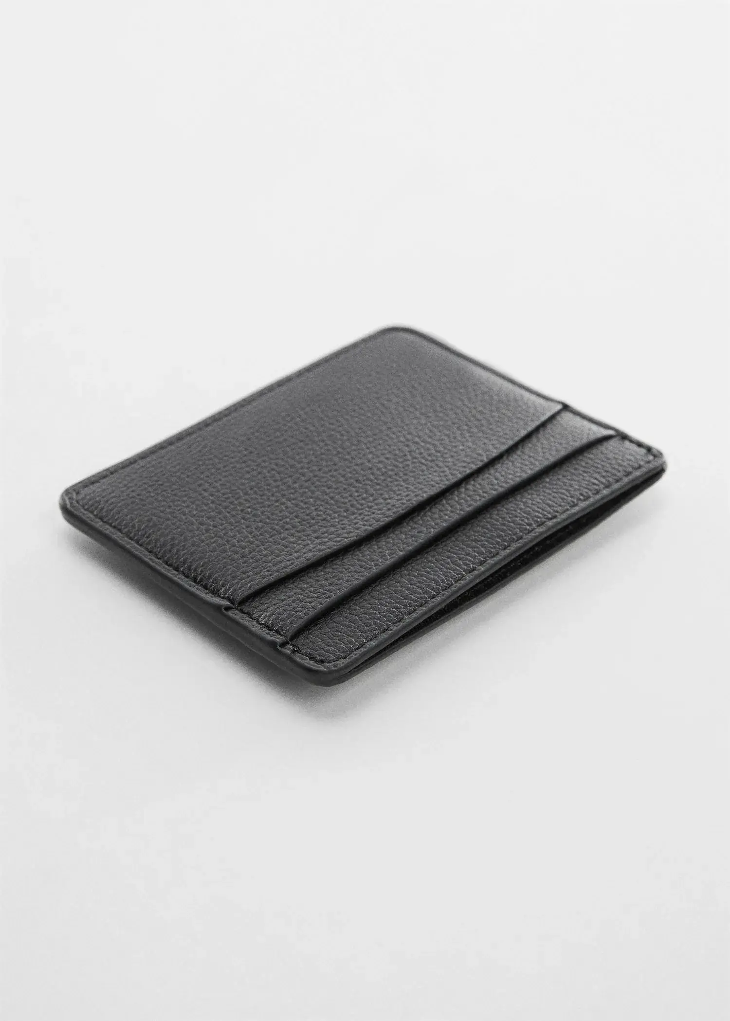 Mango Anti-contactless leather-effect card holder. a card holder is sitting on top of a table. 
