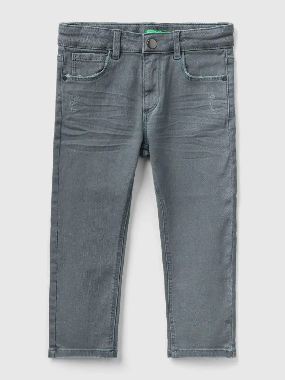 Benetton jeans with small rips. 1