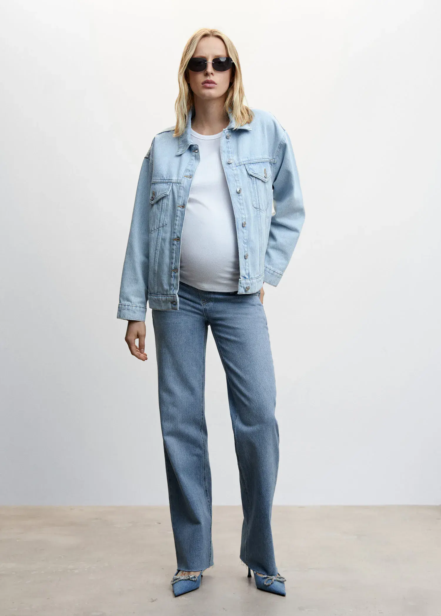 Mango Maternity wideleg jeans. a pregnant woman wearing jeans and a jacket. 