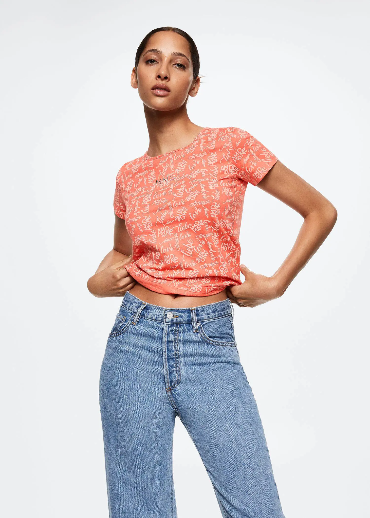 Mango Printed cotton-blend T-shirt. a woman wearing a pair of jeans and a t-shirt. 