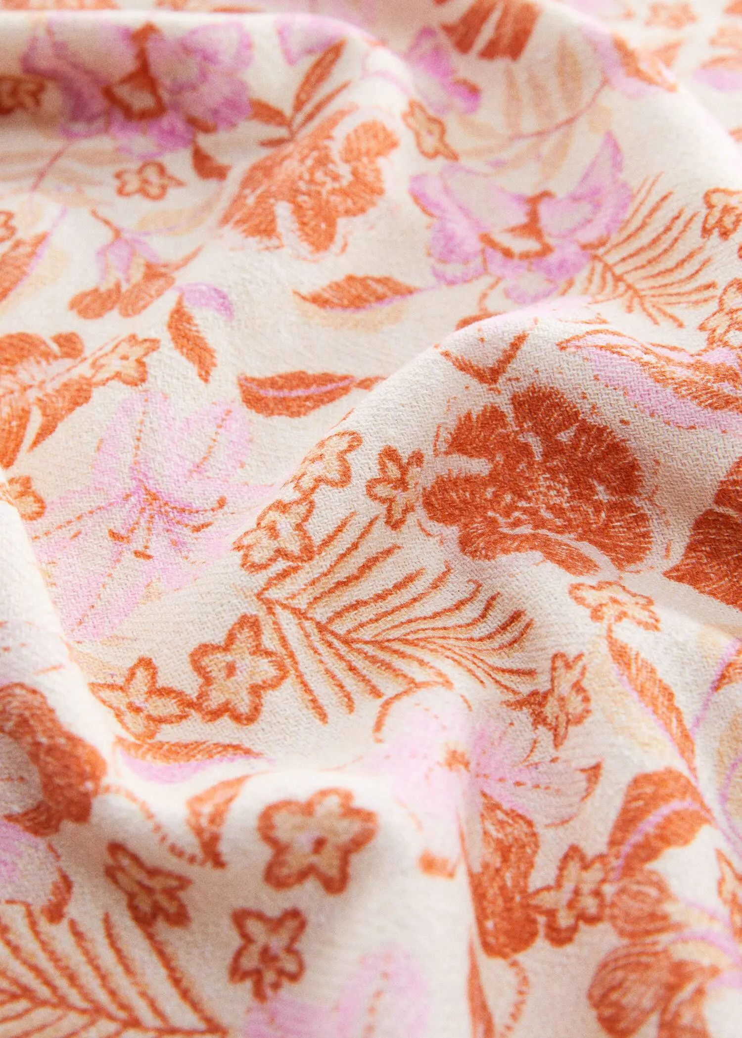 Mango 100% Cotton flower towel. a close-up view of a floral fabric. 