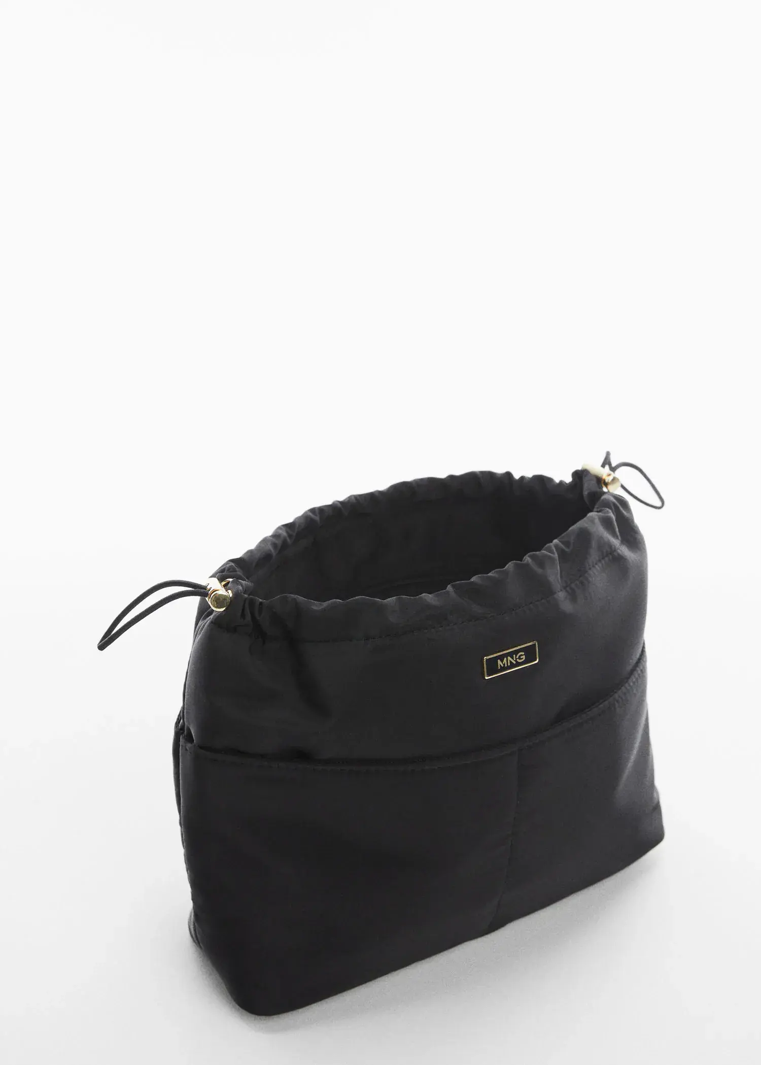 Mango Leather bowling bag. a black purse sitting on top of a white table. 