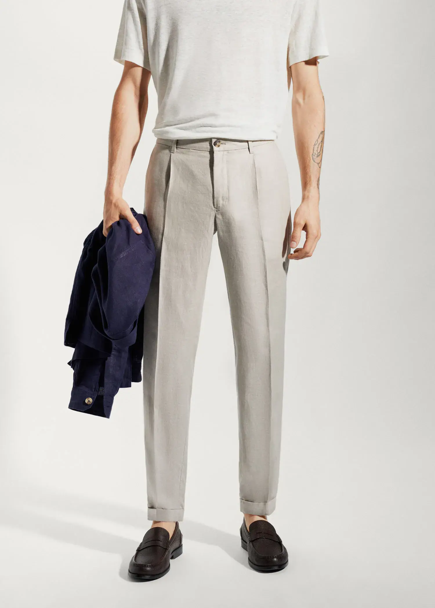 Mango 100% linen regular-fit trousers. a man in a white shirt and a jacket. 