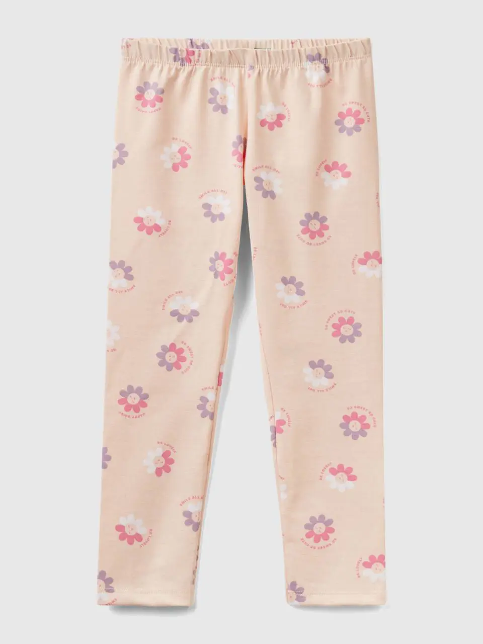 Benetton pastel pink leggings with floral print. 1