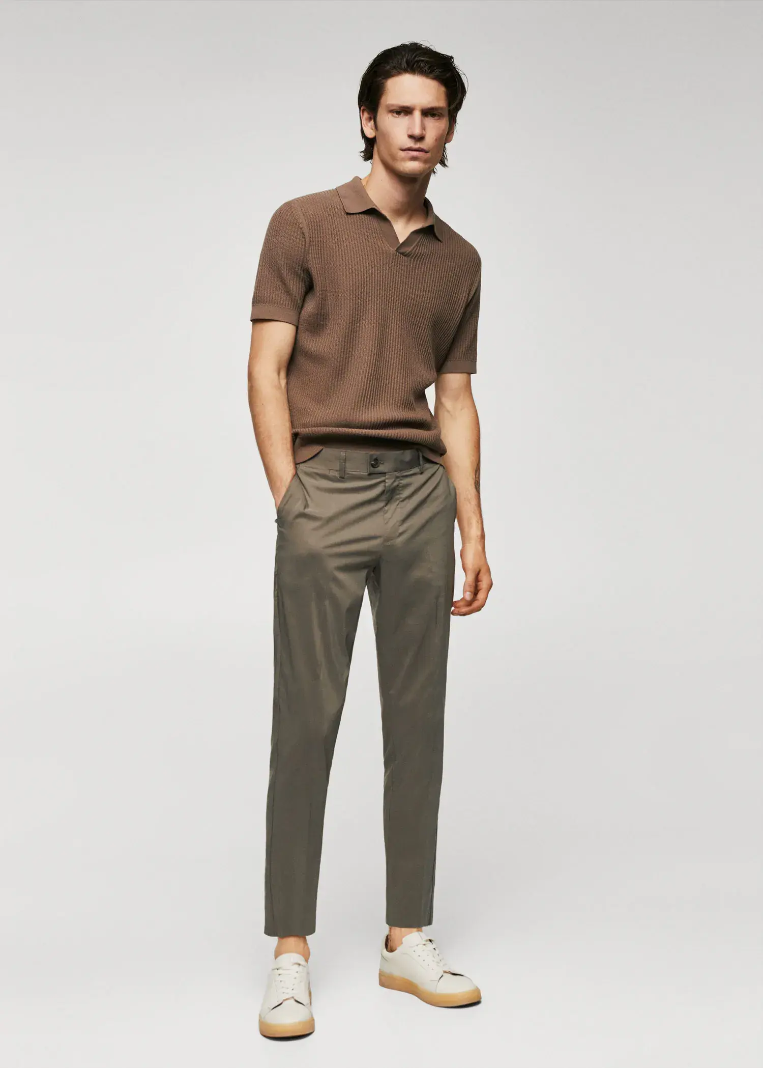 Mango Lightweight cotton trousers. a man in a brown polo shirt and brown pants. 