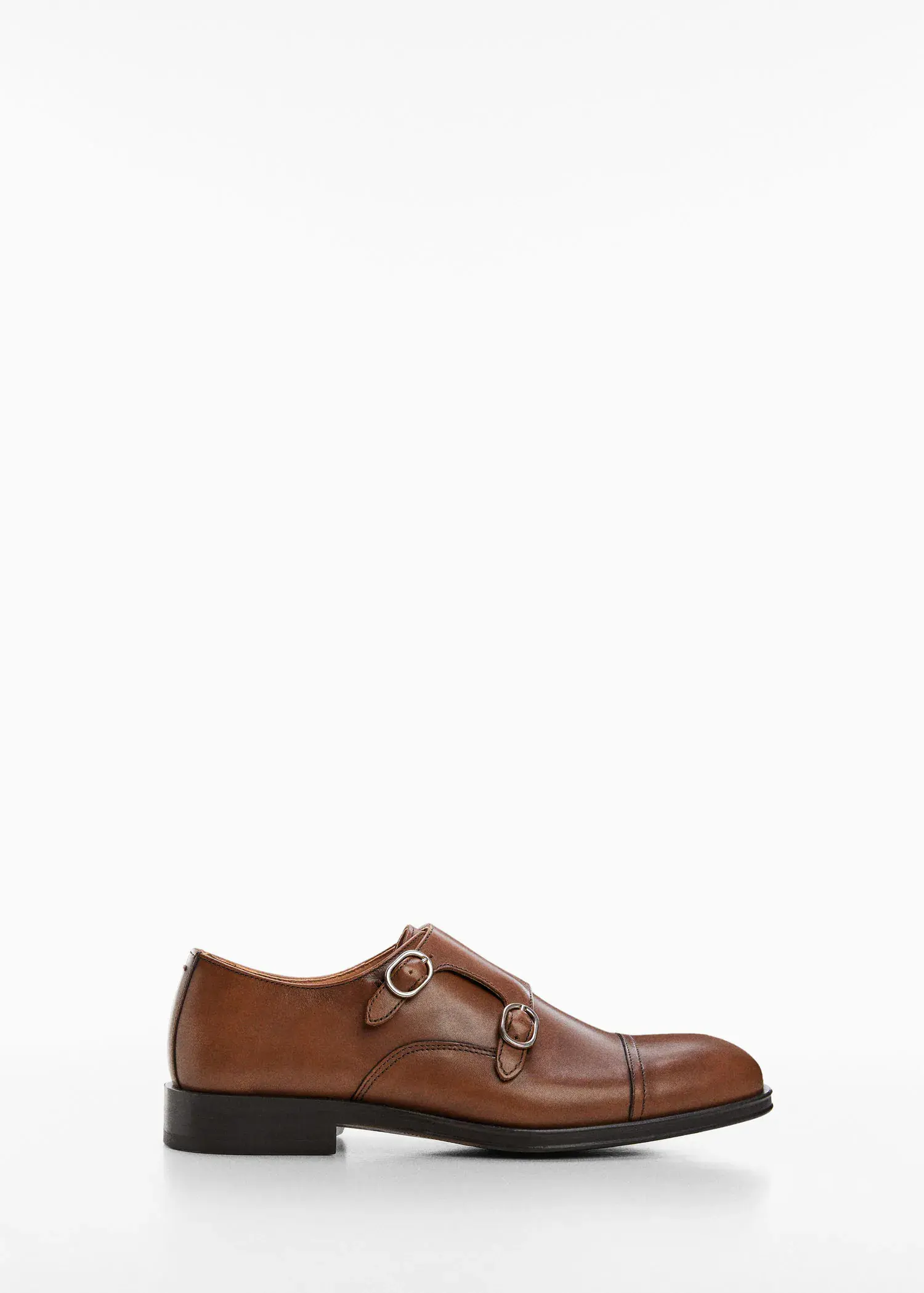 Mango Monk shoes with leather buckle. a pair of brown shoes on a white background. 