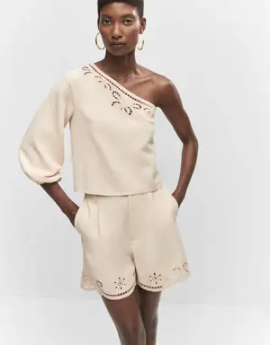 Asymmetrical embroidered openwork top