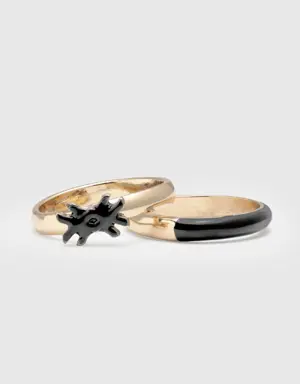two rings with black enamelled details