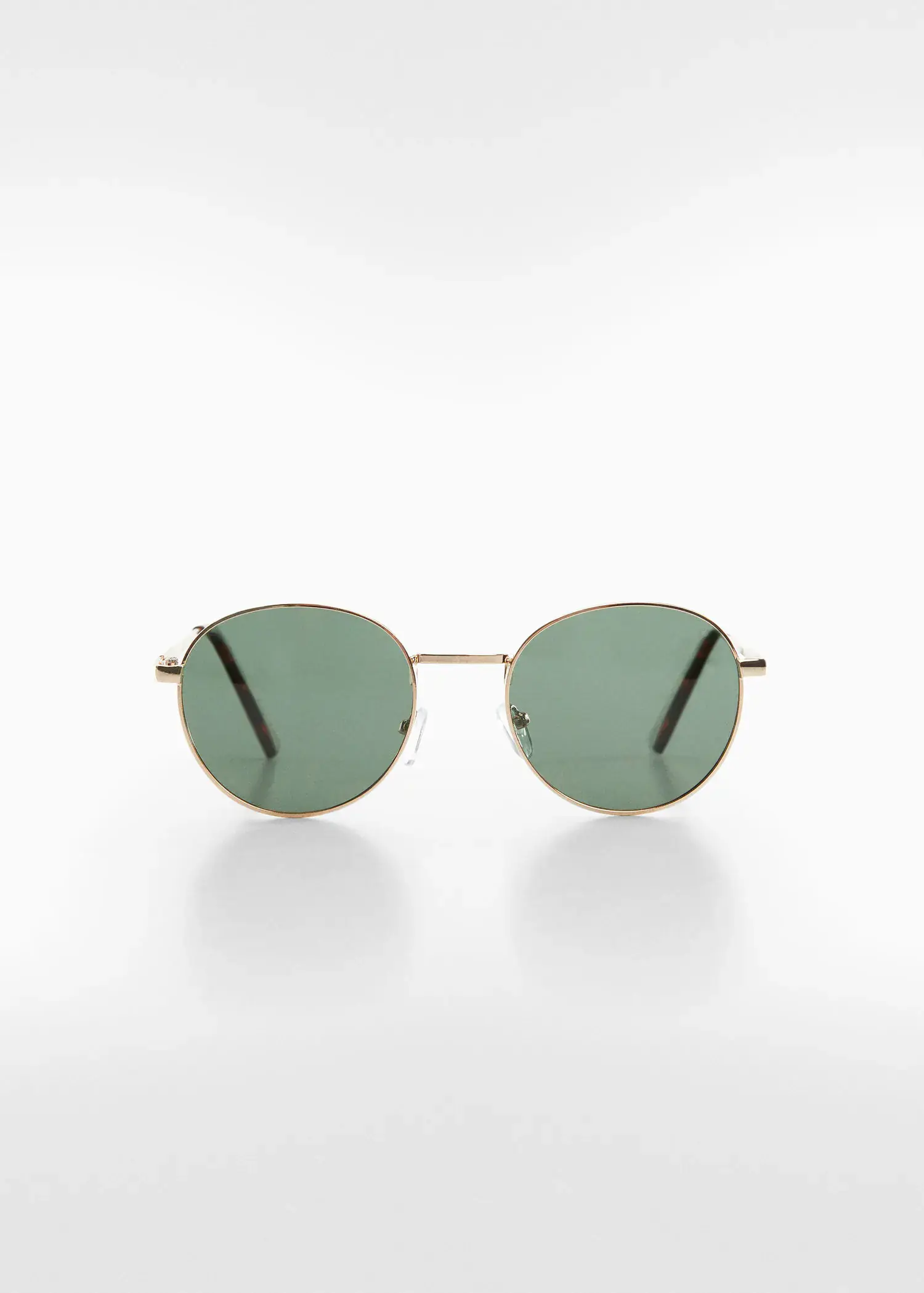 Mango Polarised sunglasses. a pair of green sunglasses sitting on top of a white table. 