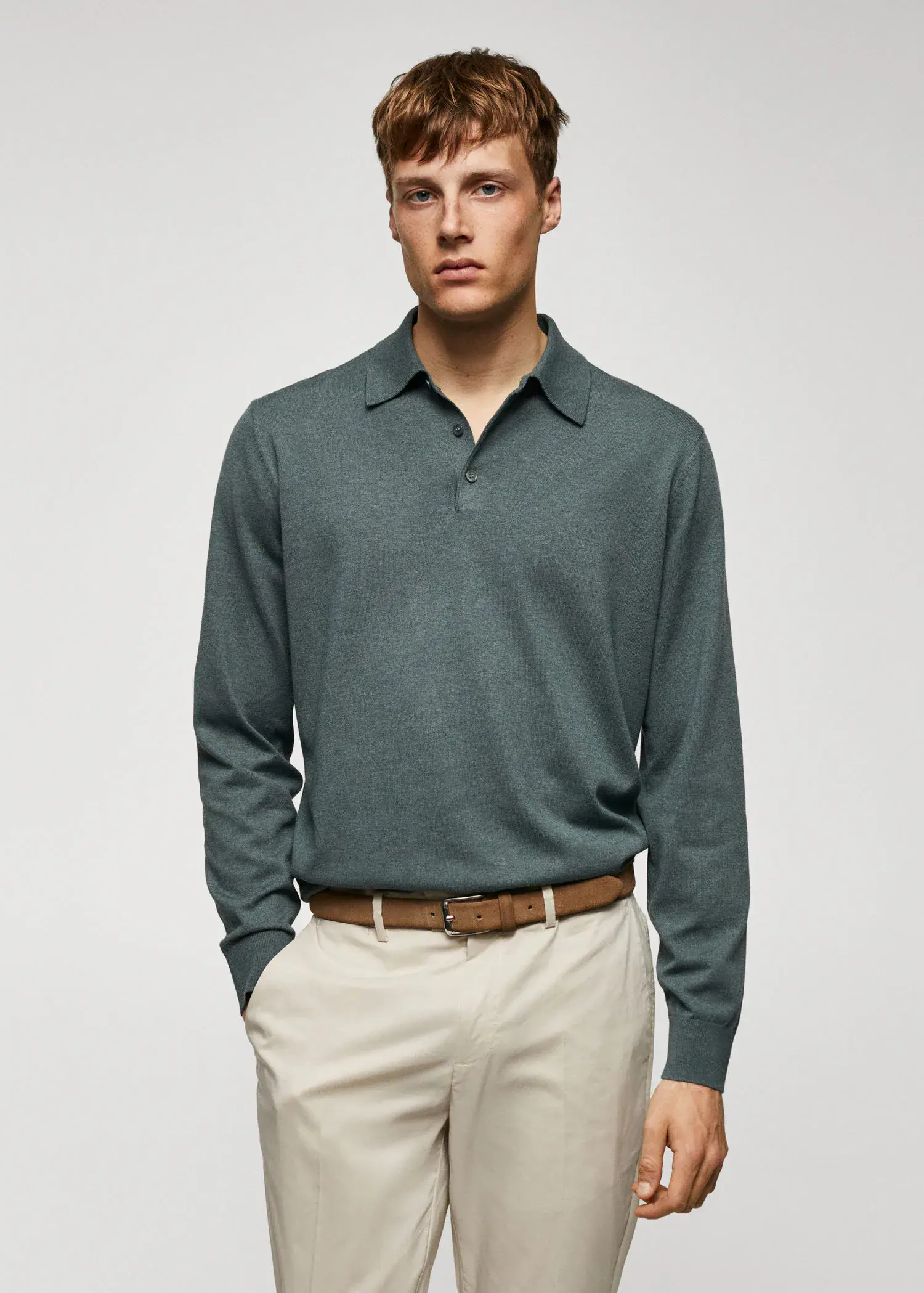 Mango Long-sleeved cotton jersey polo shirt. a man wearing a green shirt and beige pants. 