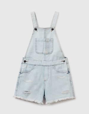 denim dungarees with rips