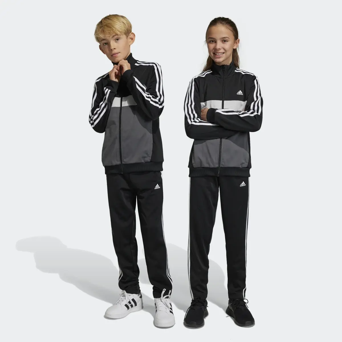 Adidas Track suit Essentials 3-Stripes Tiberio. 1