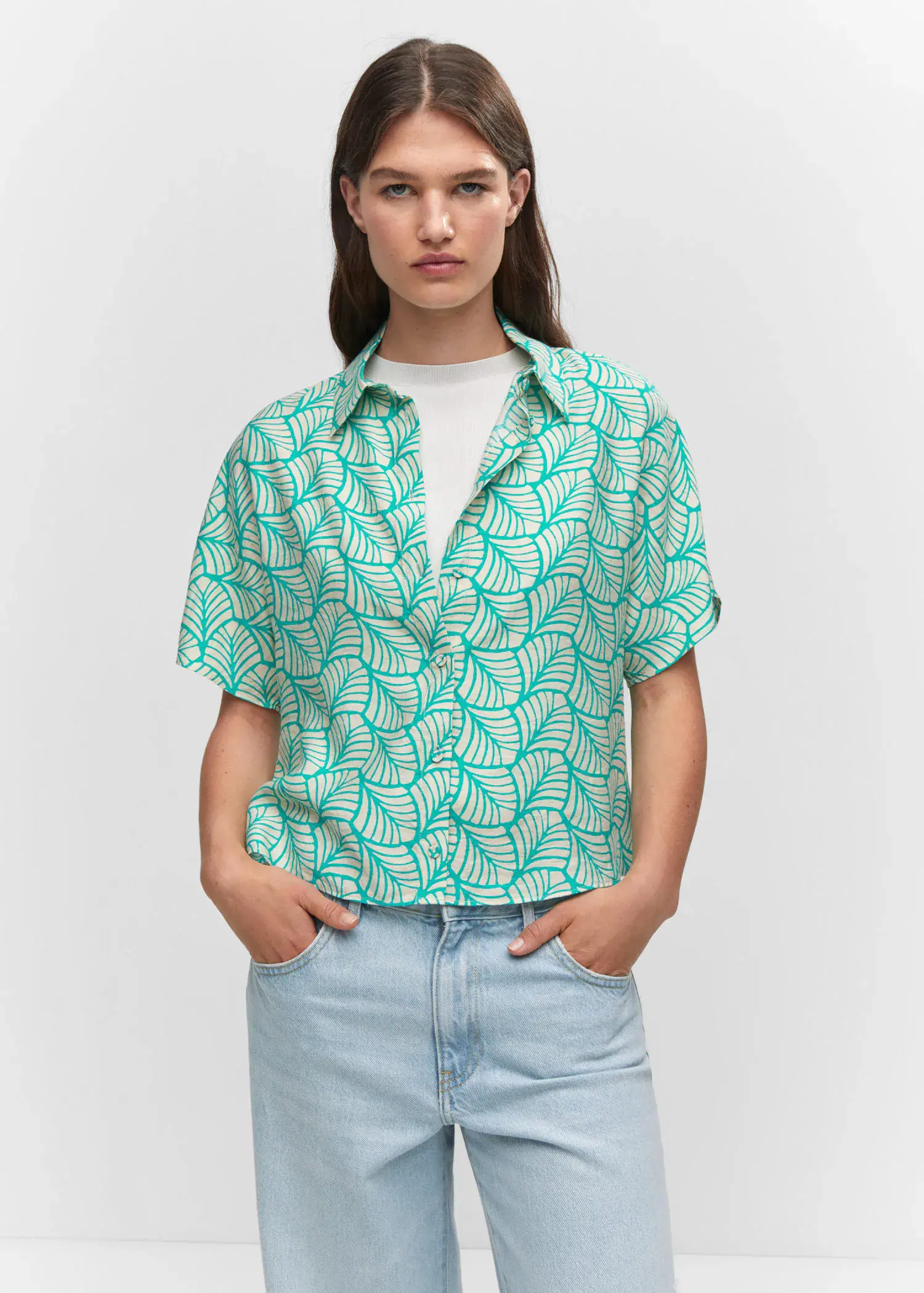 Mango Buttoned printed shirt. a woman wearing a green and white leaf patterned shirt. 