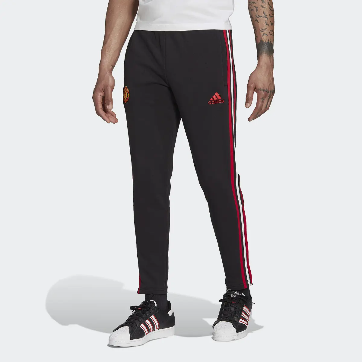 Adidas Manchester United DNA 3-Stripes Tracksuit Bottoms. 1