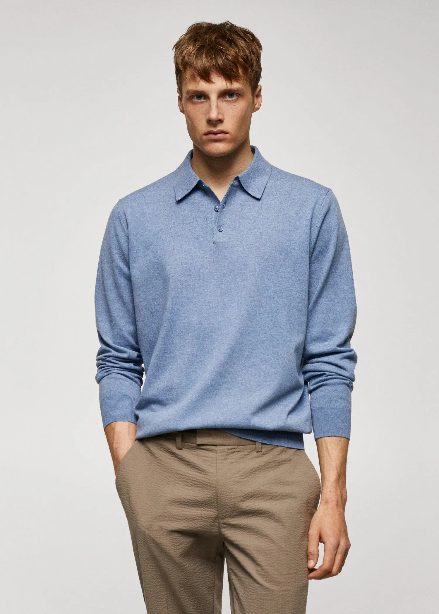 Mango Long-sleeved cotton jersey polo shirt. a man wearing a blue shirt and brown pants. 