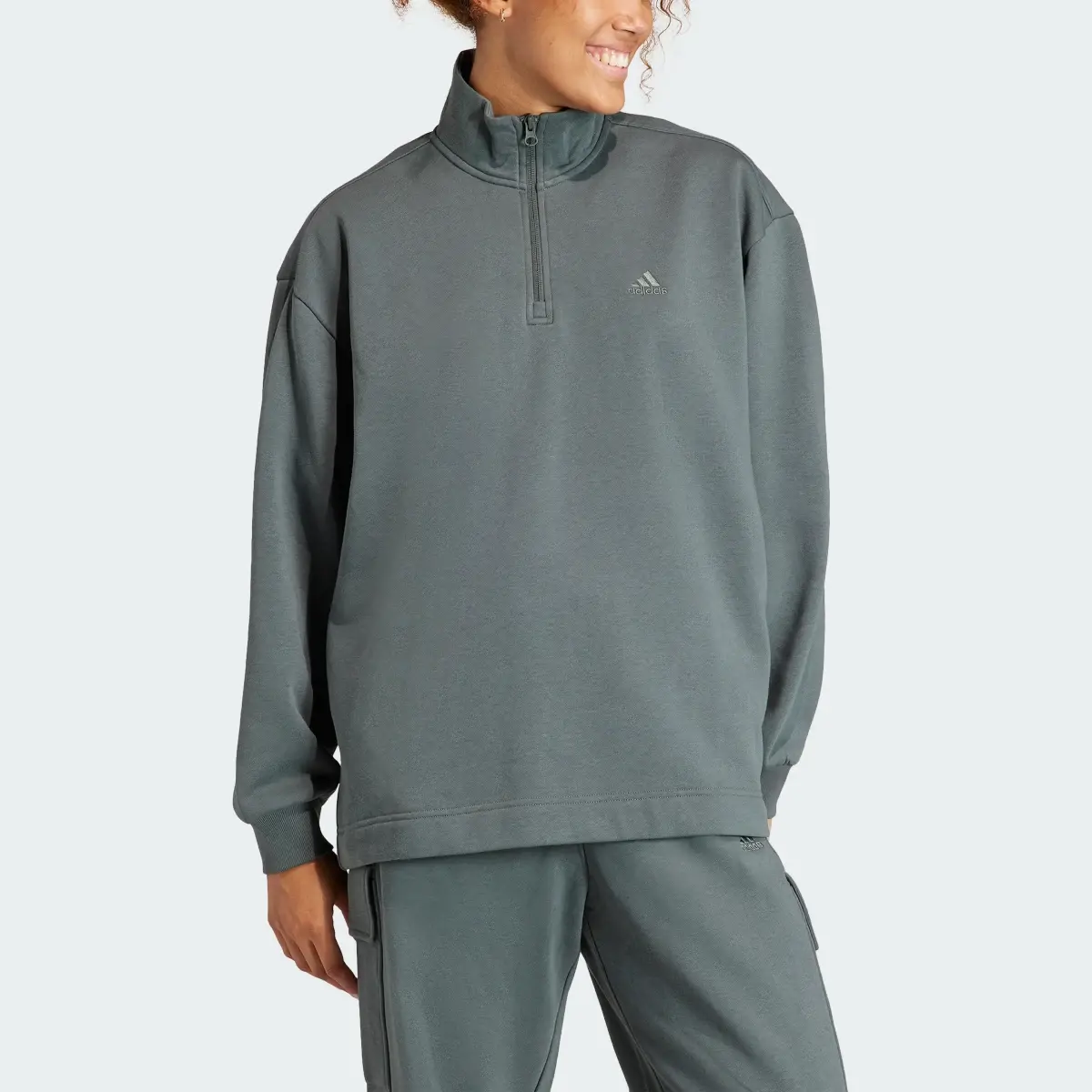 Adidas ALL SZN Fleece Quarter-Zip Sweatshirt. 1