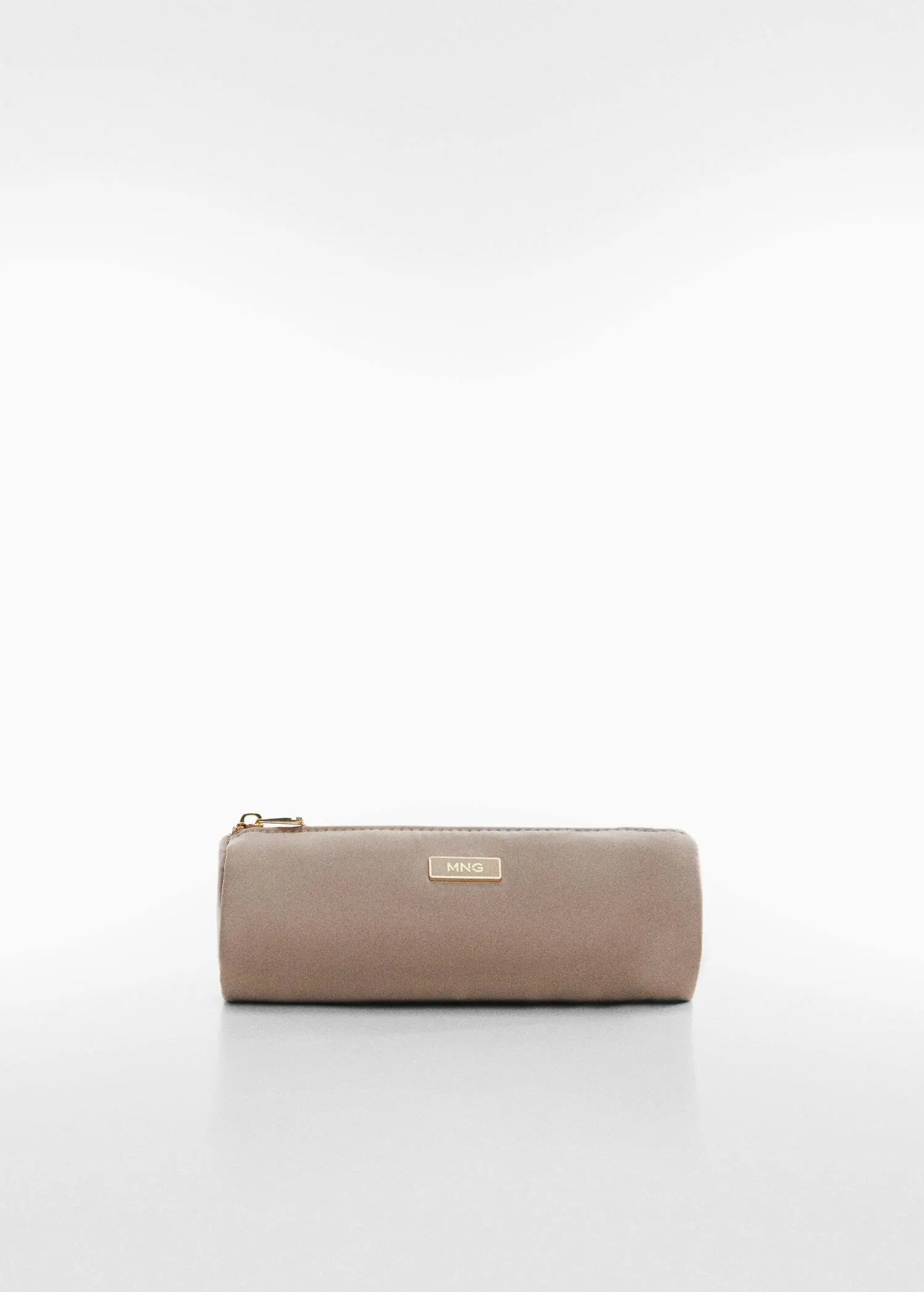 Mango Nylon case. a beige purse sitting on top of a white table. 