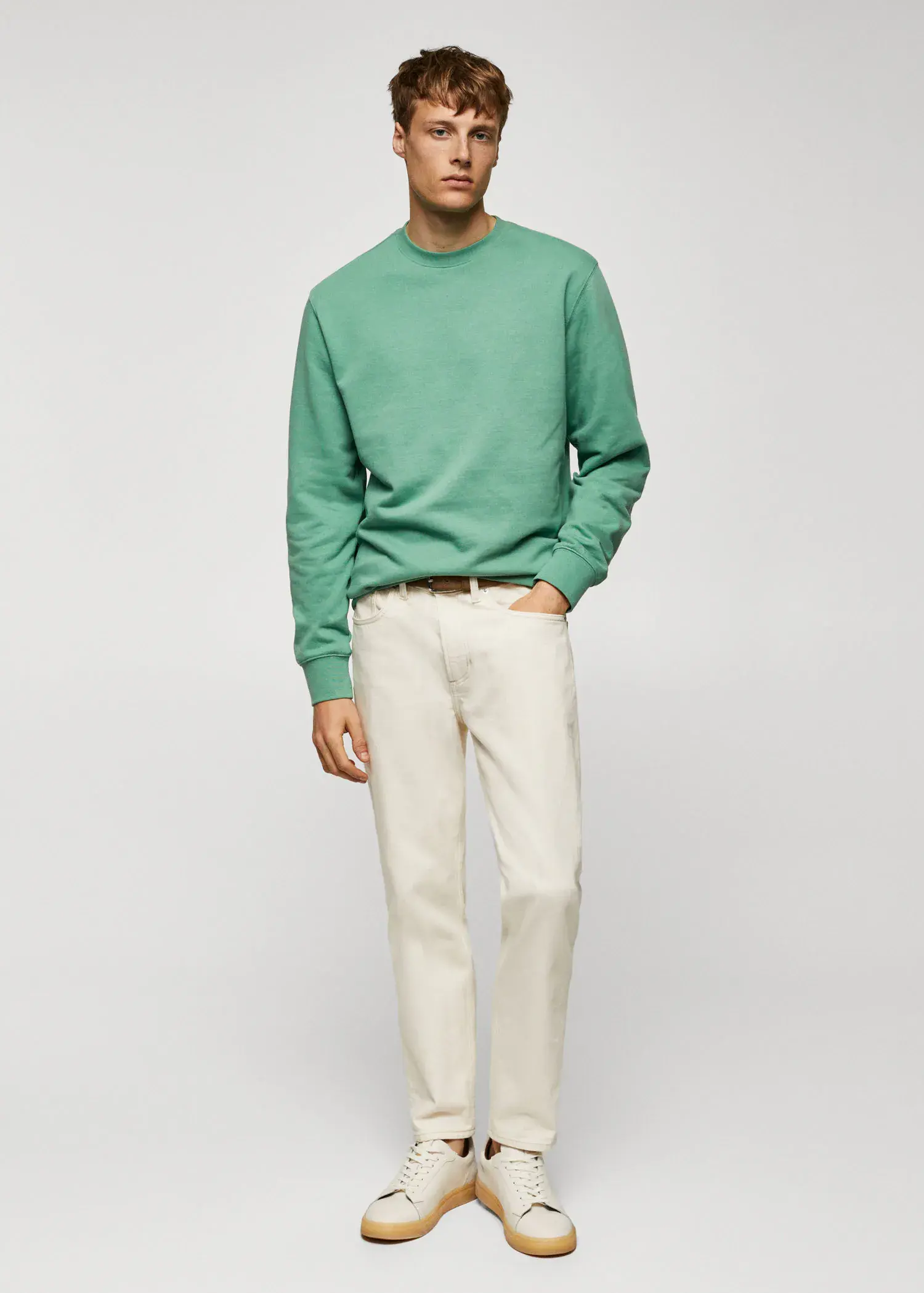 Mango 100% cotton basic sweatshirt . a man wearing a green sweatshirt and white pants. 