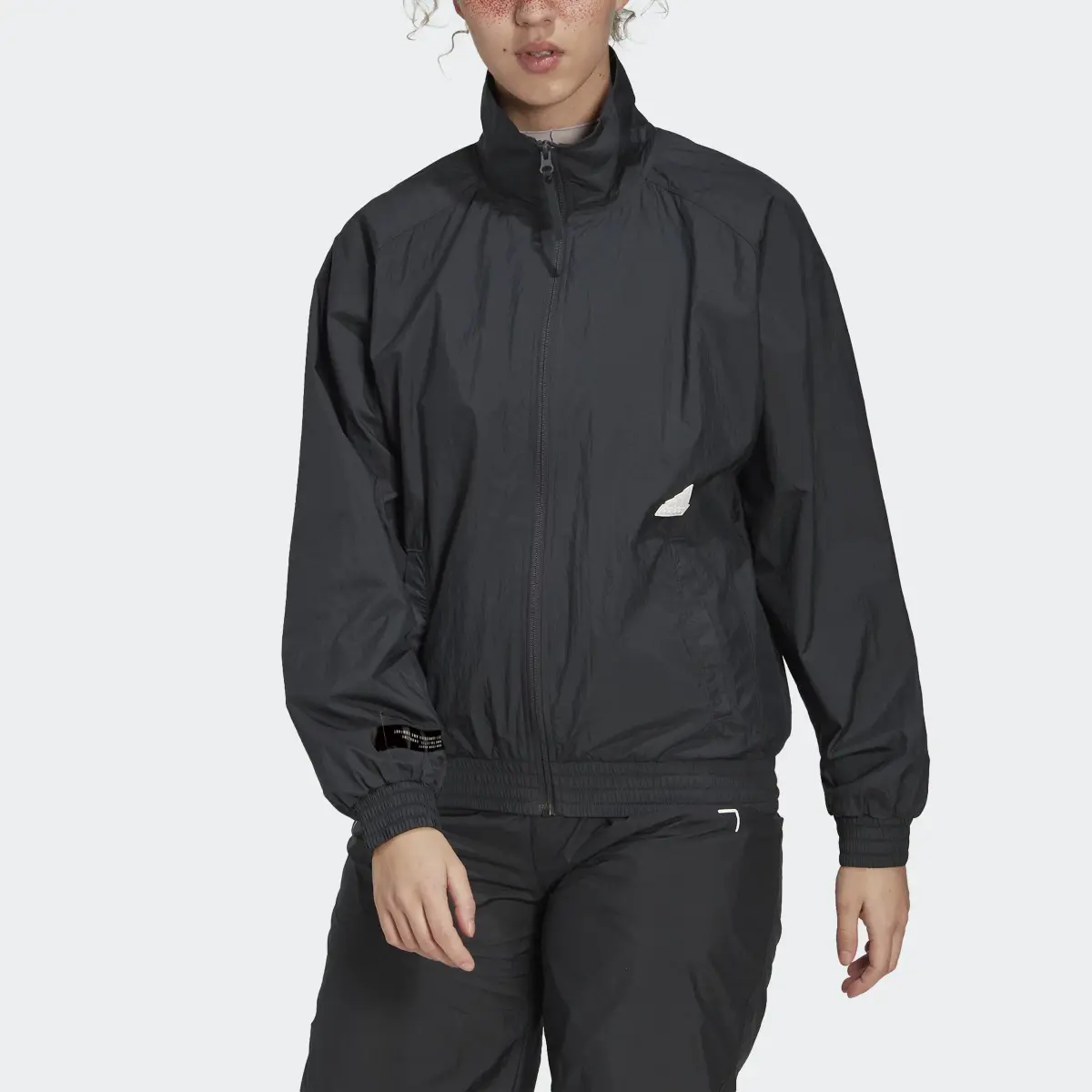 Adidas Woven Track Top. 1