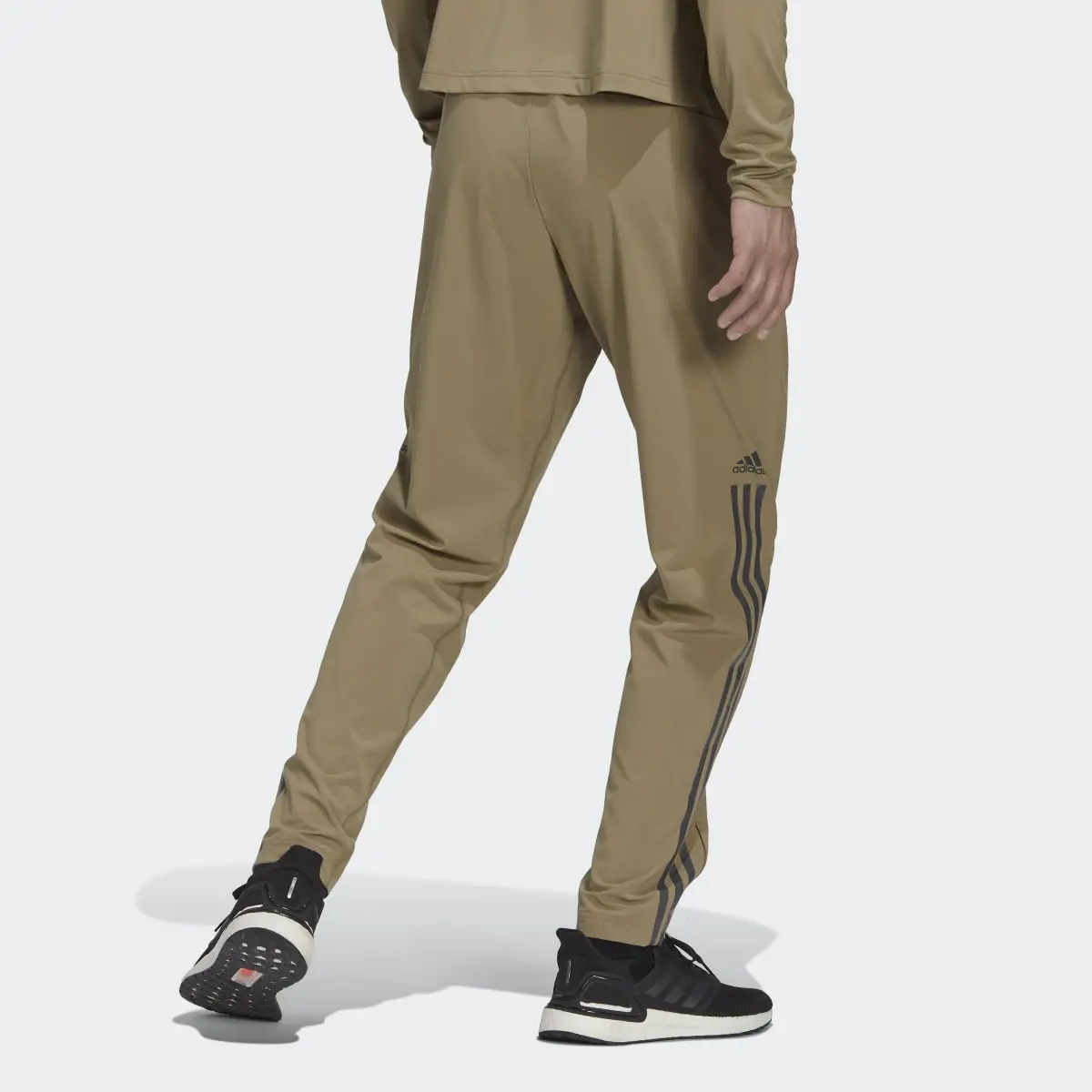 Adidas AlphaStrength Woven Zip Pants. 2
